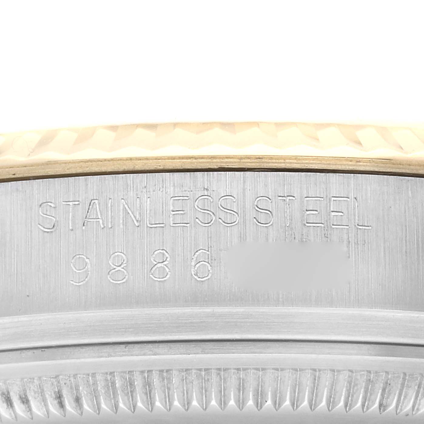 Close-up of the side of a Rolex Vintage Collection 16013 Men's Steel and Gold (two tone) Champagne Dial 16013 Men's Steel and Gold (two tone) Champagne Dial watch, showing the stainless steel case and model number.