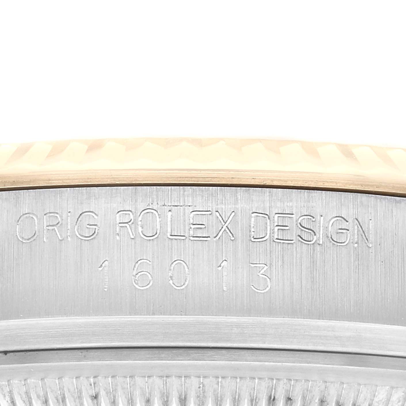 The image shows a close-up angle of the casing side of a Rolex Vintage Collection 16013 Men's Steel and Gold (two tone) Champagne Dial 16013 Men's Steel and Gold (two tone) Champagne Dial model, engraved with "ORIG ROLEX DESIGN 16013."