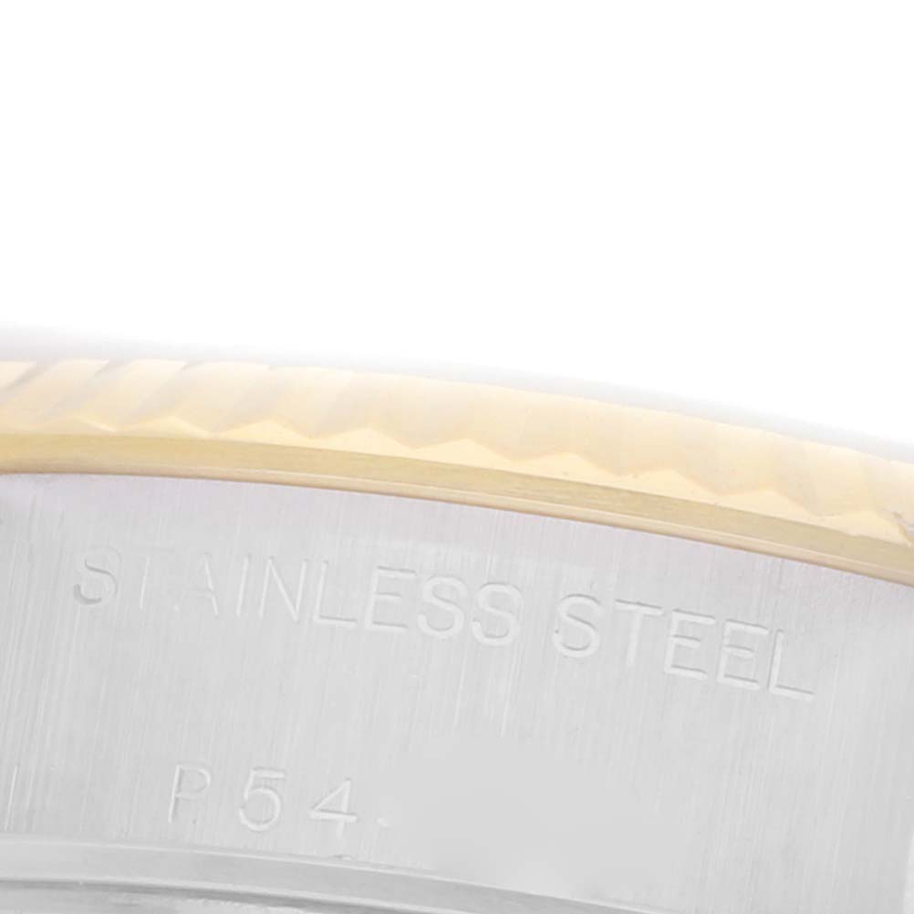 The image shows a close-up of the bezel and case edge of a Rolex Datejust 79173 Women's Steel and Gold (two tone) White Dial 79173 Women's Steel and Gold (two tone) White Dial, highlighting the stainless steel engraving.