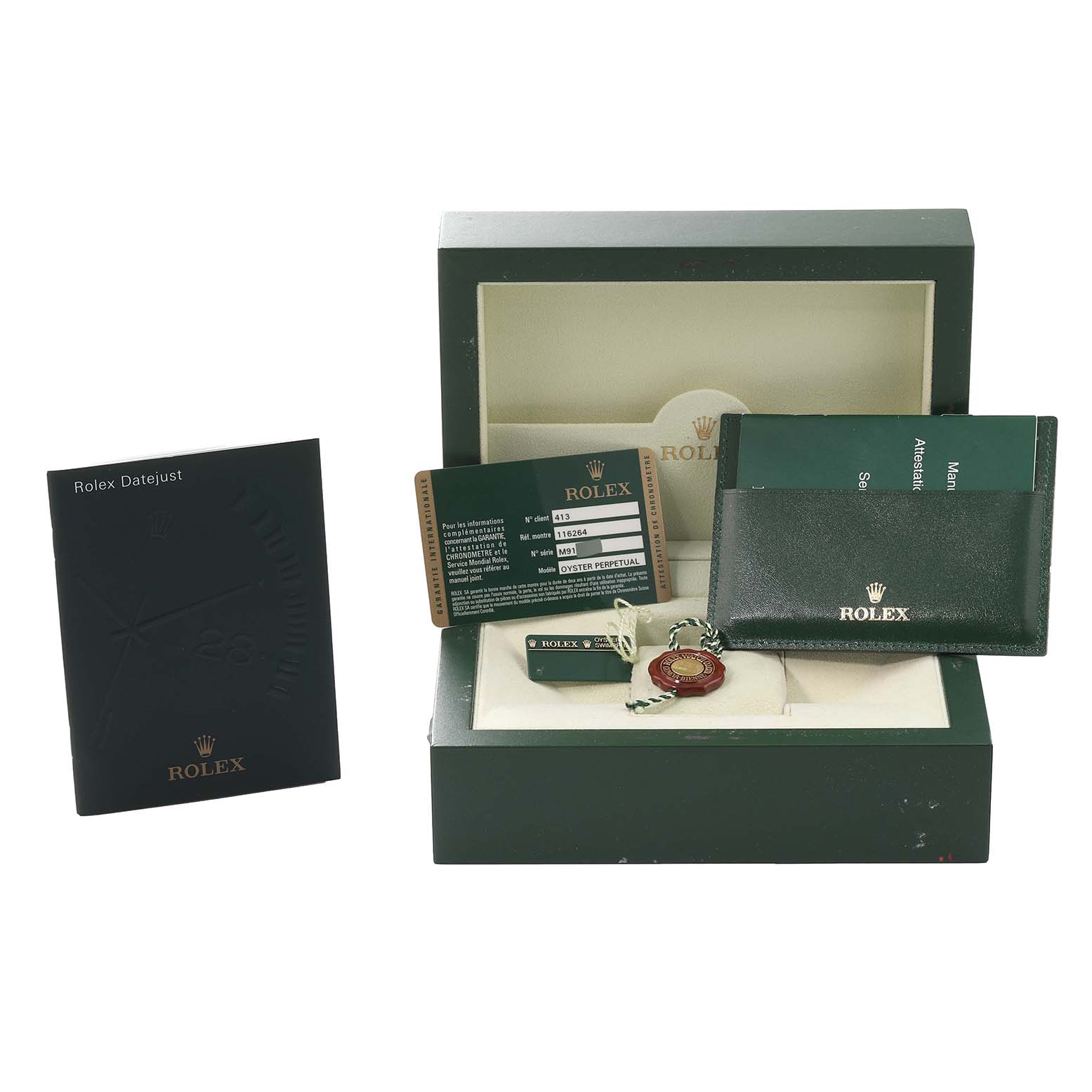 This is a Rolex Turn-o-Graph 116264 Men's Stainless Steel Black Dial 116264 Men's Stainless Steel Black Dial accessory set showing the box, manuals, ID card, and tag.