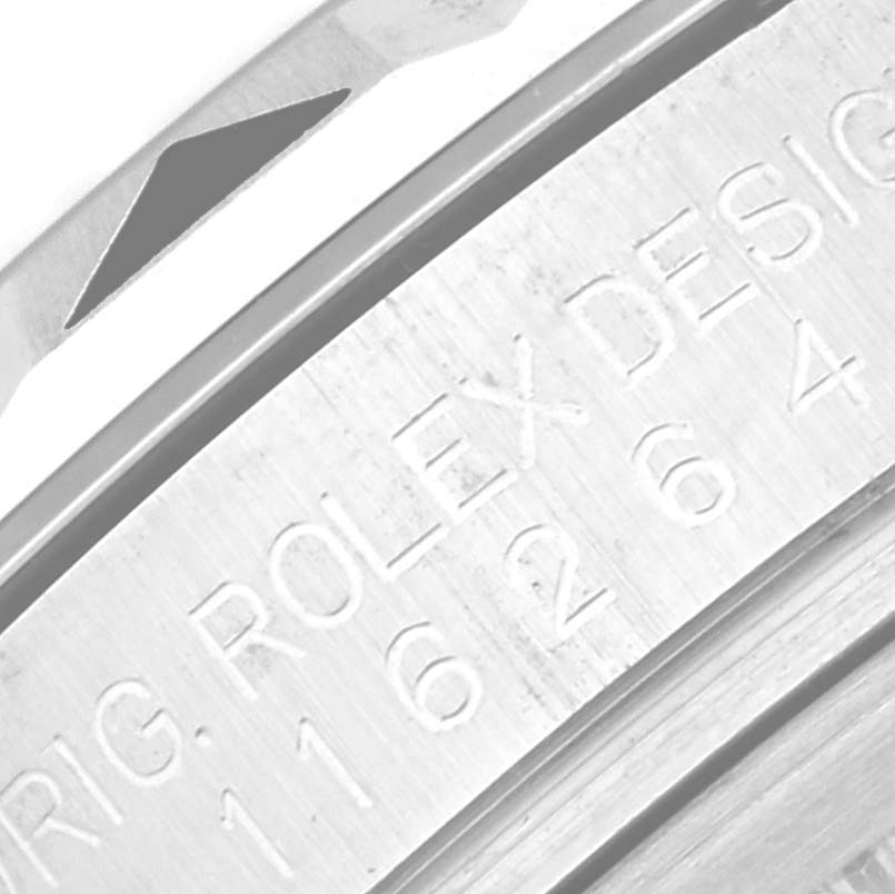 This image shows a close-up of the case with engravings of a Rolex Turn-o-Graph 116264 Men's Stainless Steel Black Dial 116264 Men's Stainless Steel Black Dial model watch.