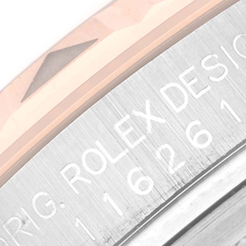 This close-up image shows a portion of the bezel and casing of the Rolex Turn-o-Graph 116261 Men's Steel and Gold (two tone) Black Dial 116261 Men's Steel and Gold (two tone) Black Dial watch.