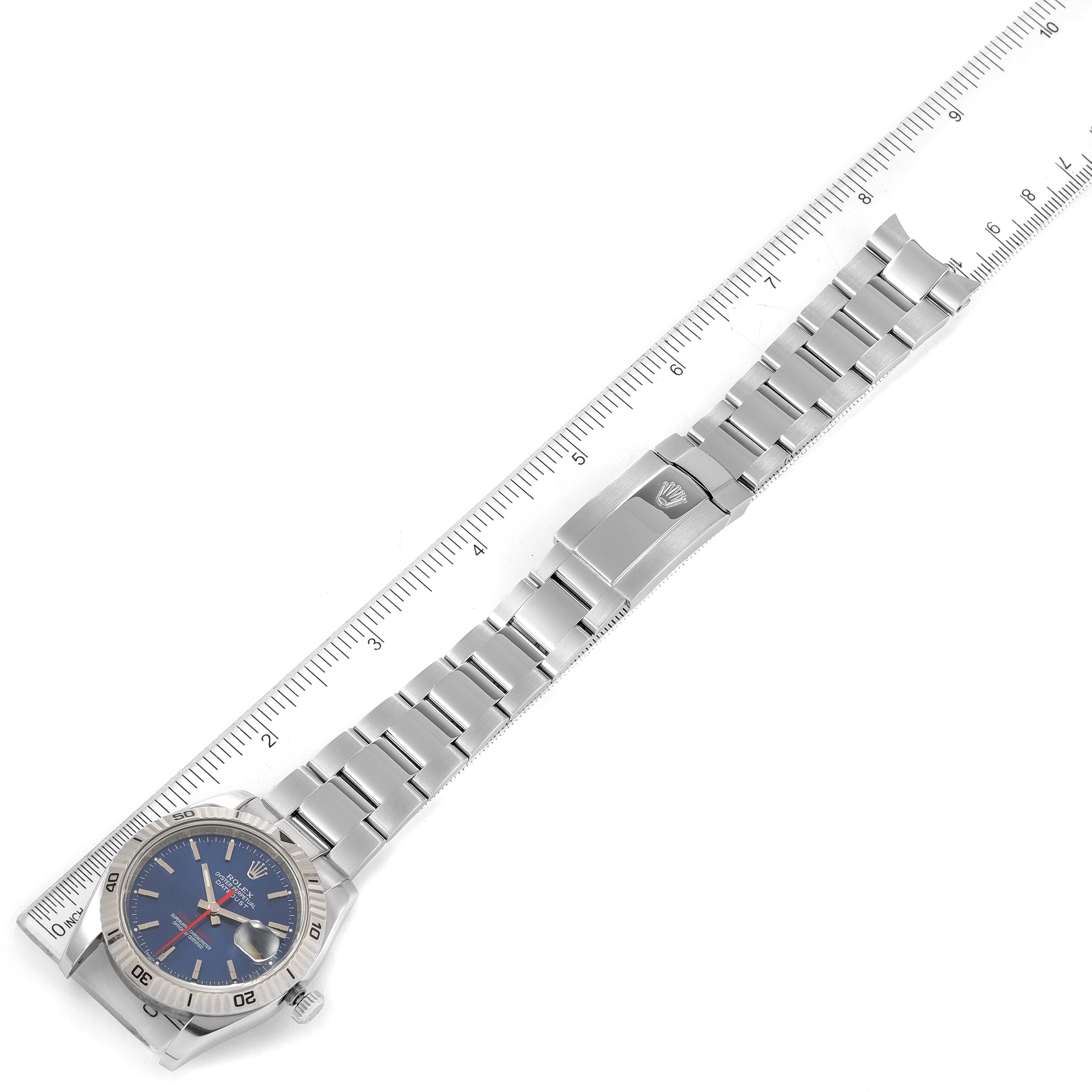 The image shows the full length of a Rolex Turn-o-Graph 116264 Men's Stainless Steel Blue Dial 116264 Men's Stainless Steel Blue Dial watch, including its face, bezel, bracelet, and clasp, alongside a ruler for scale.