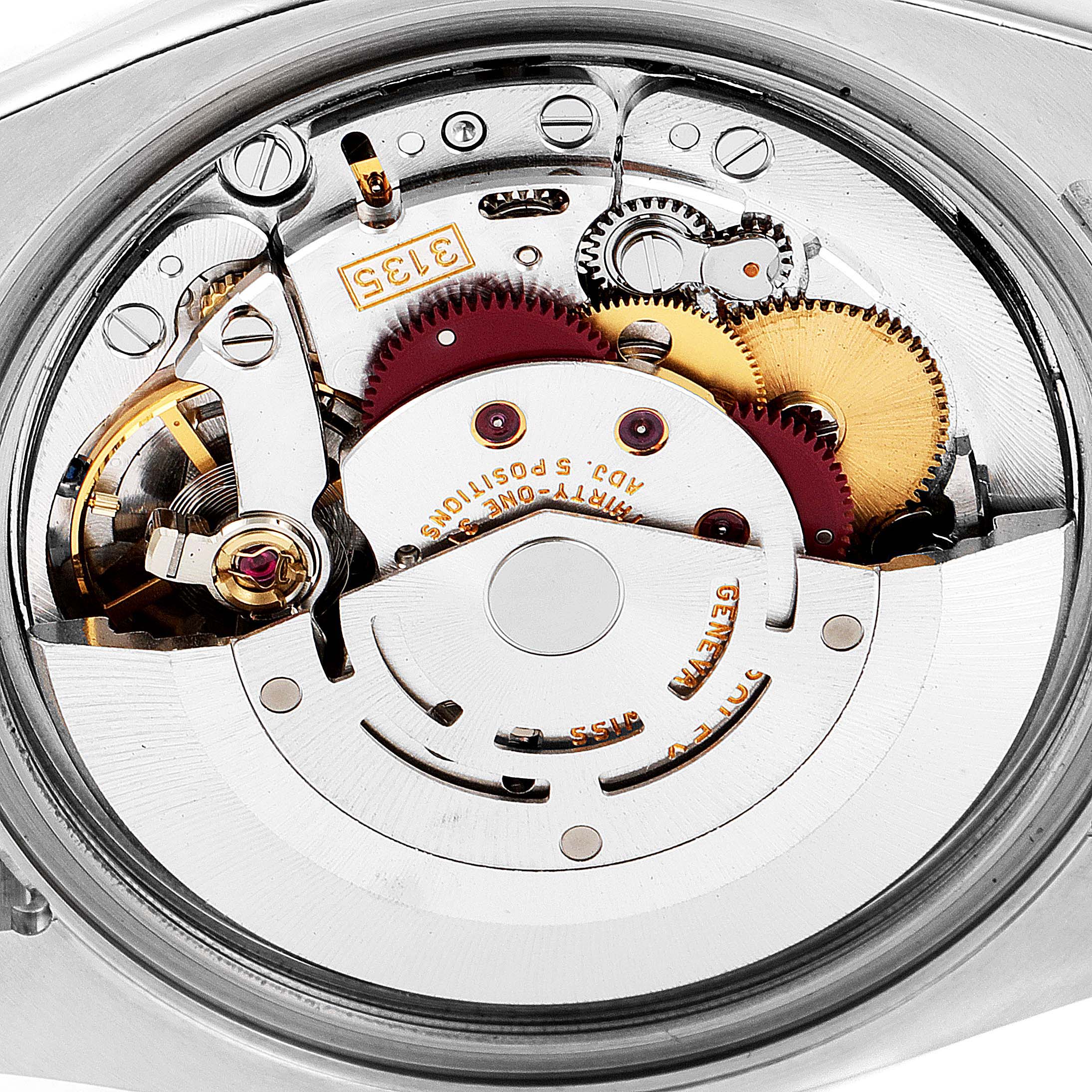 The image shows the internal mechanism and parts of a Rolex Turn-o-Graph 116264 Men's Stainless Steel Blue Dial 116264 Men's Stainless Steel Blue Dial watch from an angled close-up view.