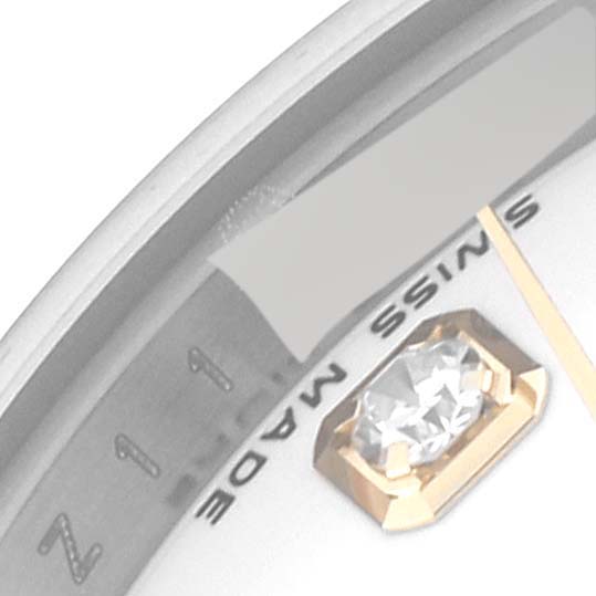 This is a close-up of the dial of a Rolex Datejust 179163 Women's Steel and Gold (two tone) White Dial 179163 Women's Steel and Gold (two tone) White Dial watch, showing part of the index, a diamond, and part of the "Swiss Made" text.