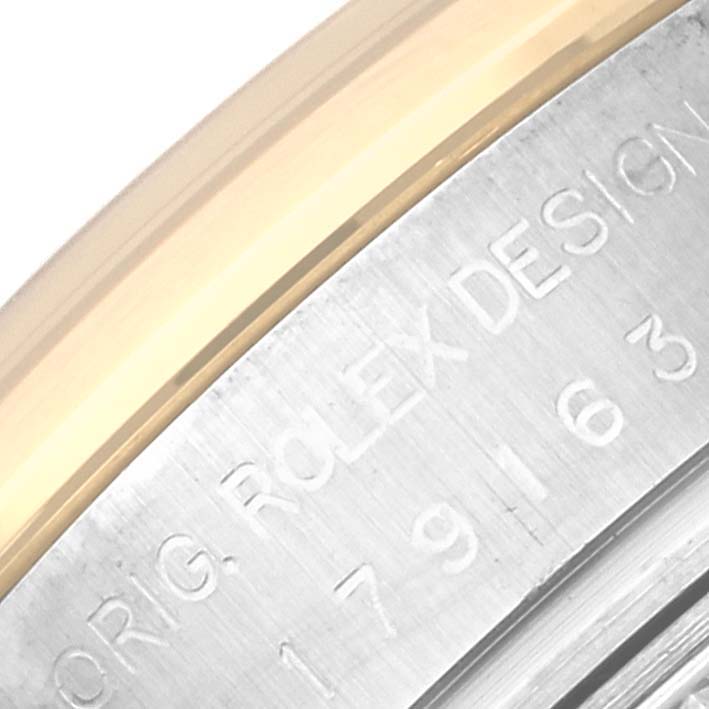 This image shows a close-up angle of the bezel edge and engraved model number of a Rolex Datejust 179163 Women's Steel and Gold (two tone) White Dial 179163 Women's Steel and Gold (two tone) White Dial watch.