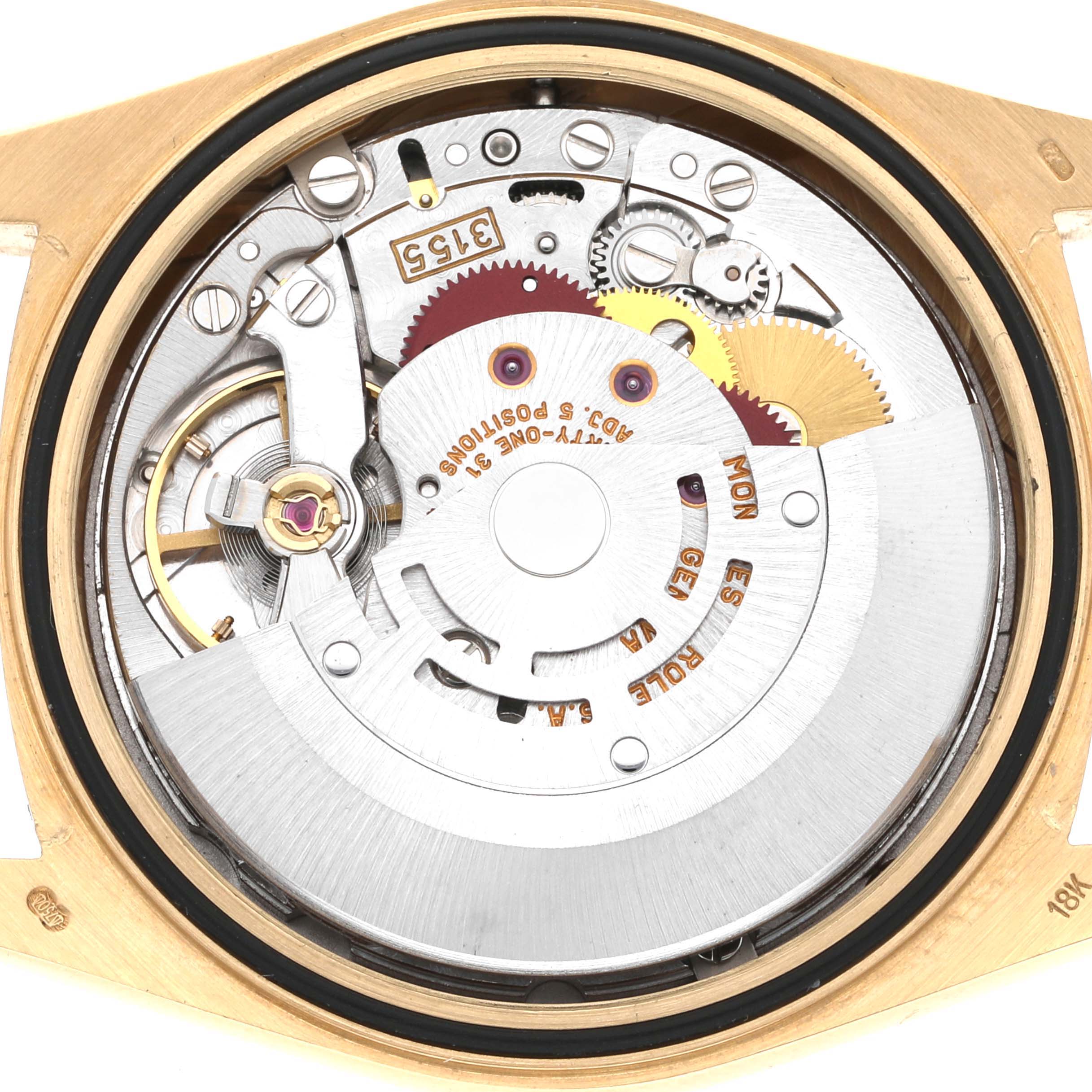 This image shows the inner mechanics and movement of a Rolex President 18238 Men
s Yellow Gold Champagne Dial 18238 Men
s Yellow Gold Champagne Dial model watch from a rear open case view.