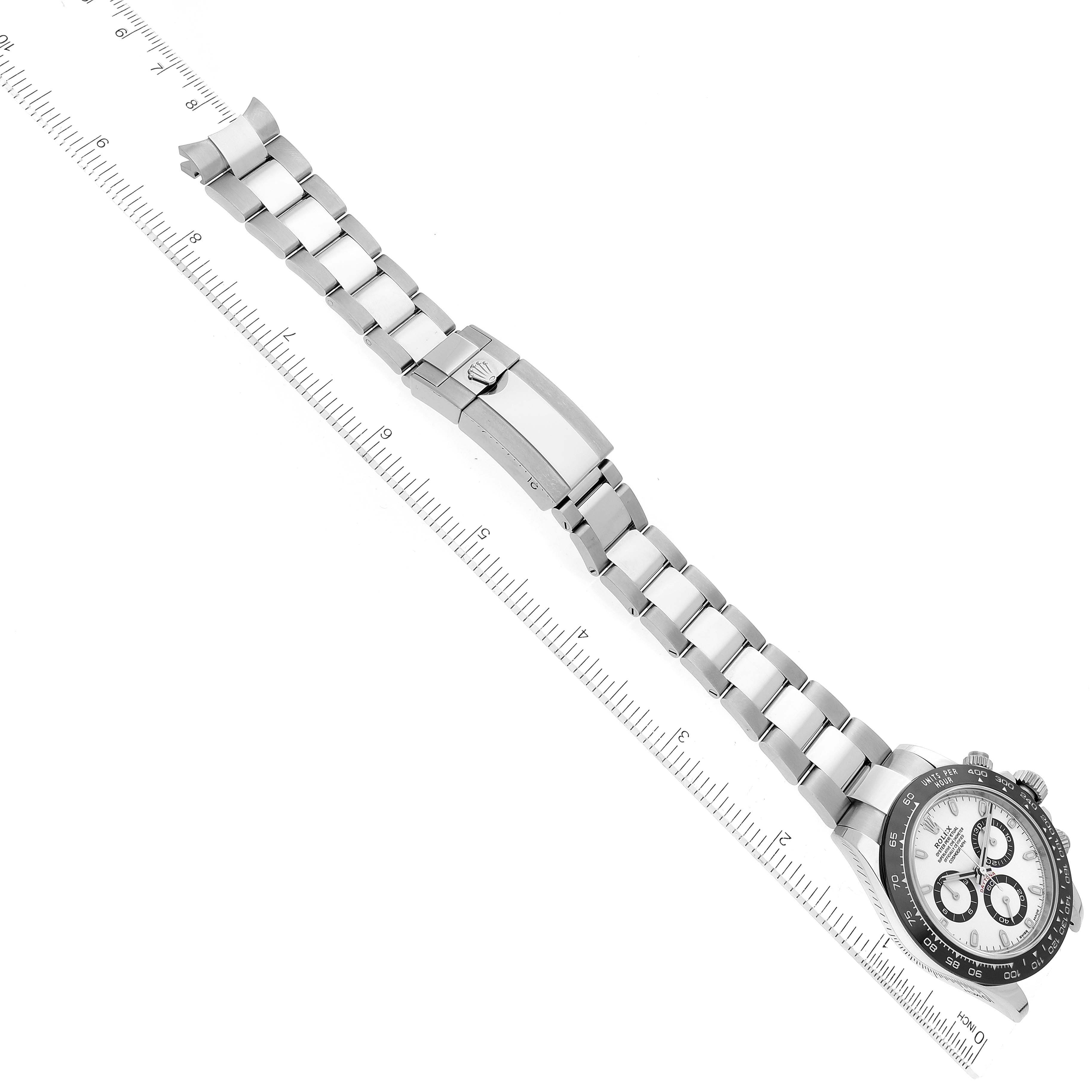 The image shows a Rolex Daytona 116500LN Men's Stainless Steel White Dial 116500LN Men's Stainless Steel White Dial watch at an angled top view, highlighting its bracelet and partially visible clasp and face.