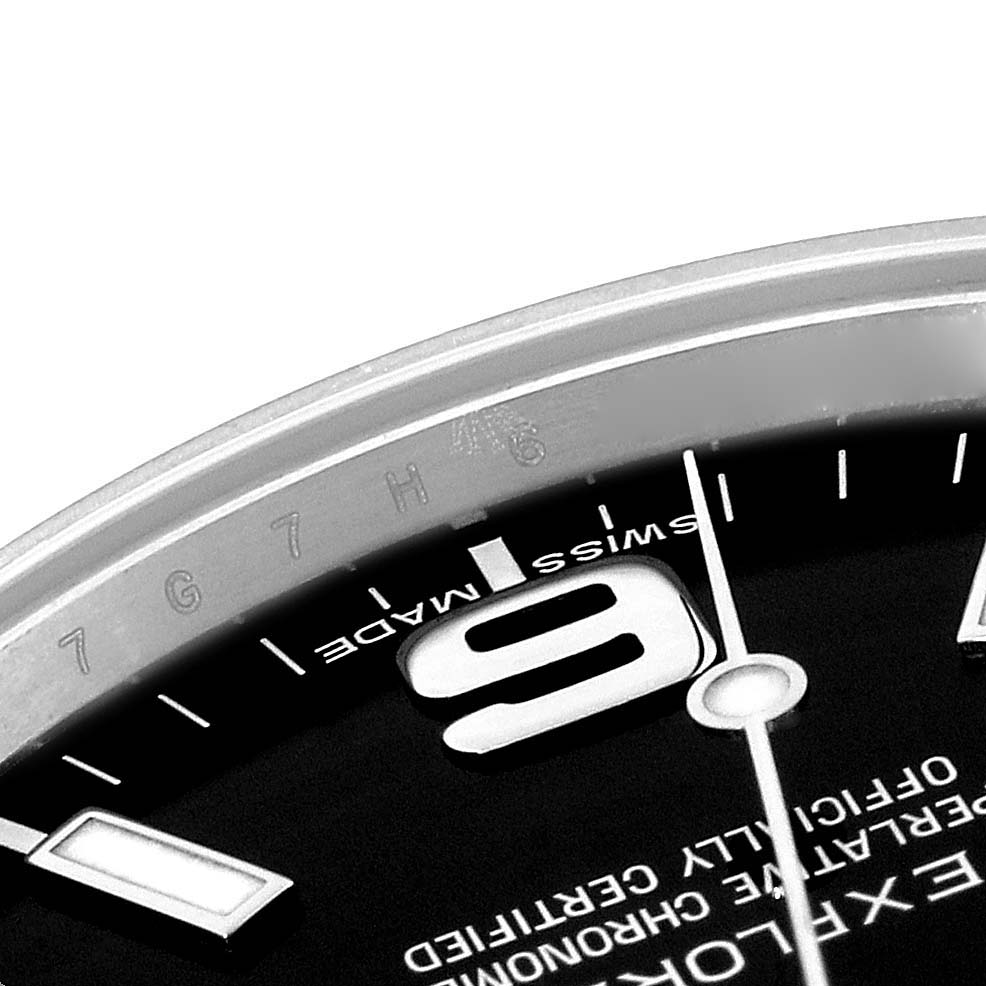 This close-up image shows the dial, part of the bezel, and hour markers of a Rolex Explorer 214270 Men
s Stainless Steel Black Dial 214270 Men
s Stainless Steel Black Dial watch.