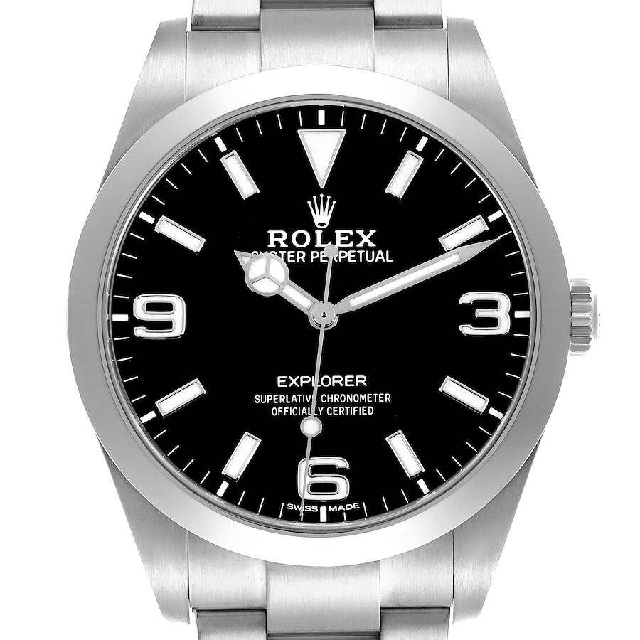 The Rolex Explorer is shown from a front angle, displaying its black dial, stainless steel bezel, and part of the bracelet.