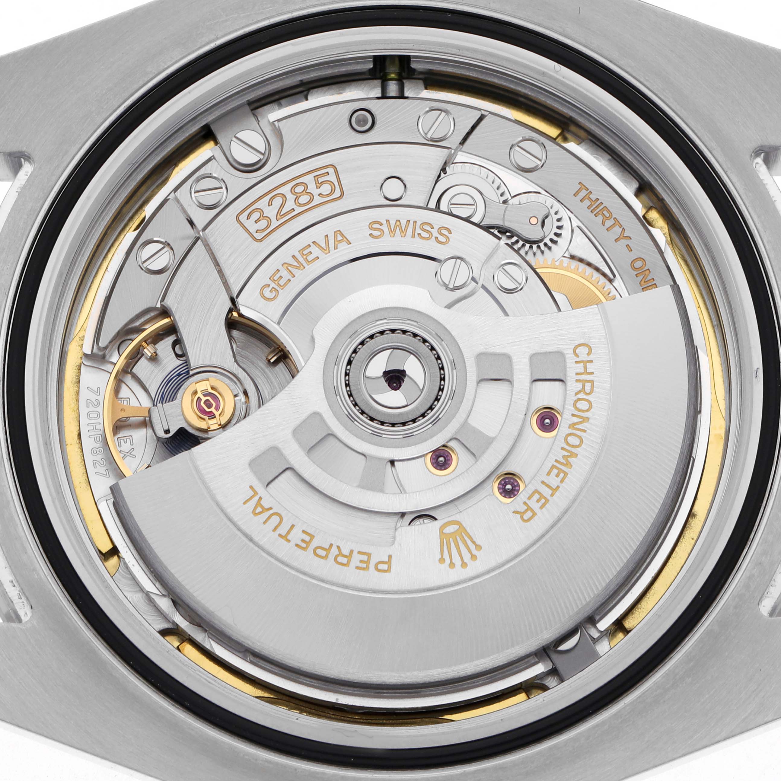 The image shows a close-up of the Rolex Explorer 226570 Men's Stainless Steel White Dial 226570 Men's Stainless Steel White Dial's movement from the back, highlighting the intricate internal components.