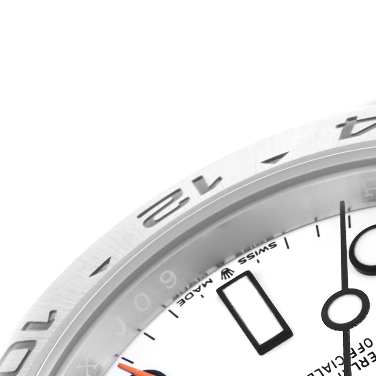 The image shows a close-up of a Rolex Explorer 226570 Men's Stainless Steel White Dial 226570 Men's Stainless Steel White Dial's bezel and partial dial with the "Swiss Made" text visible.