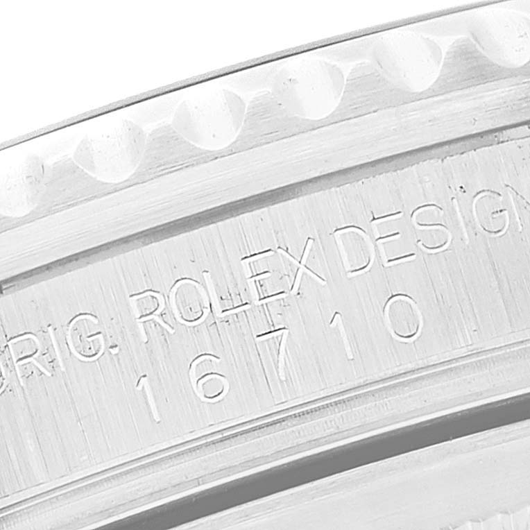 This close-up image shows the engraved case back and bezel edge of the Rolex GMT-Master 16710 Men
s Stainless Steel Black Dial 16710 Men
s Stainless Steel Black Dial model 16710.