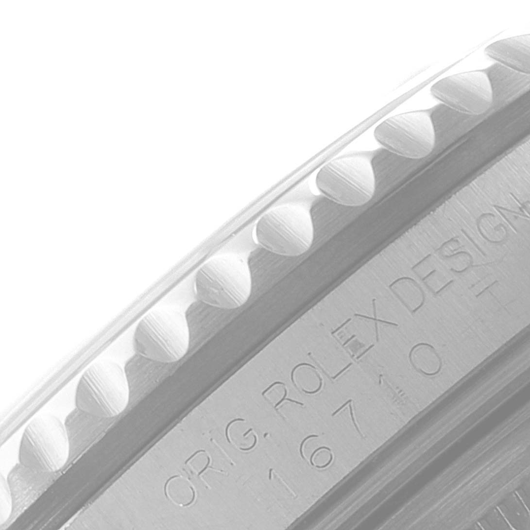 The image shows a close-up angle of the bezel and part of the case with the Rolex GMT-Master 16710 Men
s Stainless Steel Black Dial 16710 Men
s Stainless Steel Black Dial engraving.