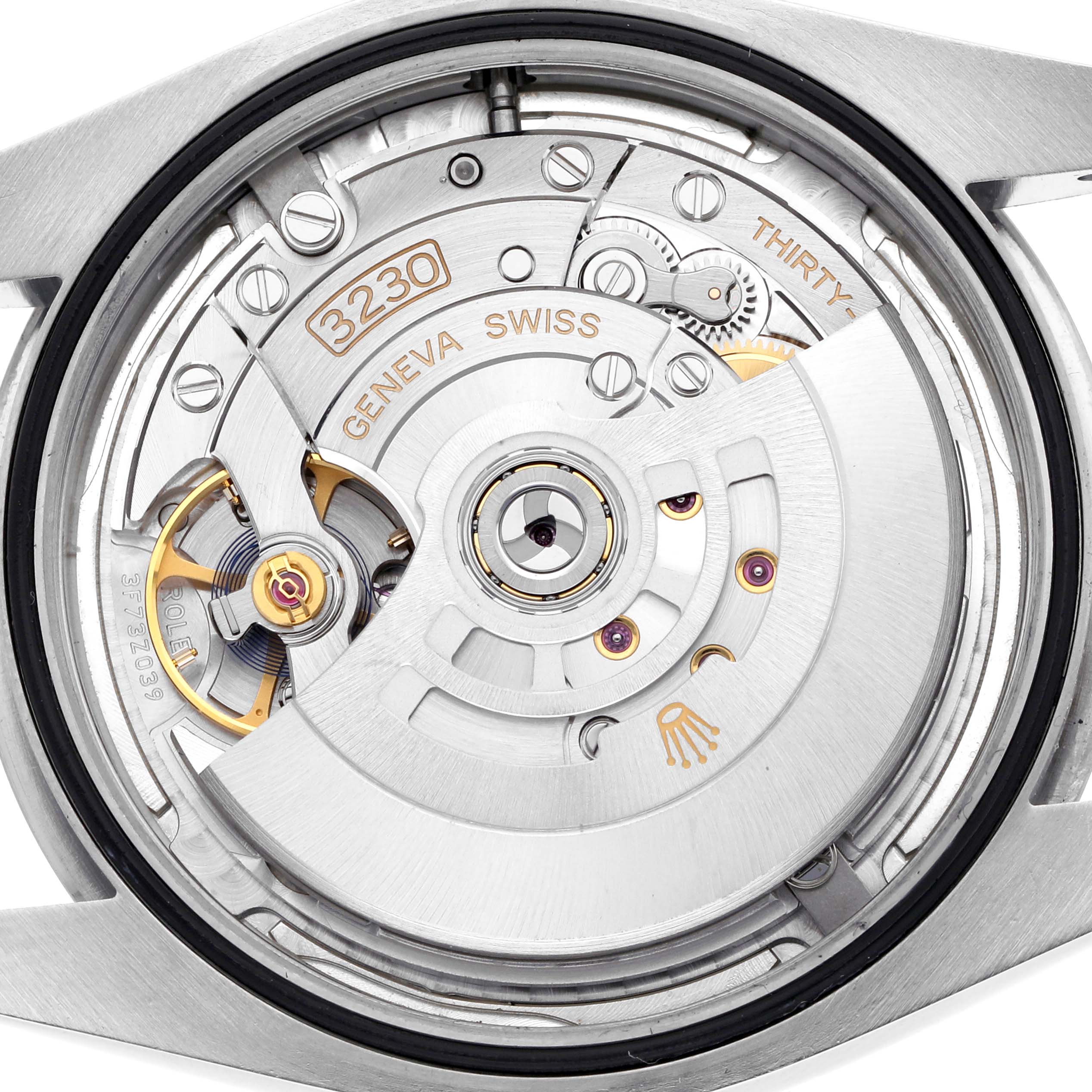 The image shows a close-up of the watch movement of a Rolex Oyster Perpetual 124300 Men's Stainless Steel Silver Dial 124300 Men's Stainless Steel Silver Dial, highlighting its internal mechanisms.