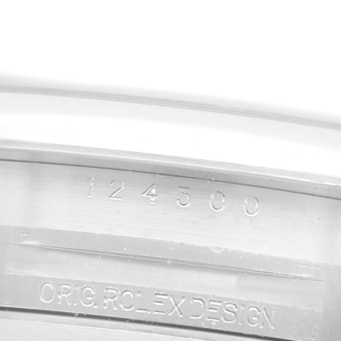 The image shows the engraved side of the case with the model number and "ORIG ROLEX DESIGN" on a Rolex Oyster Perpetual 124300 Men's Stainless Steel Silver Dial 124300 Men's Stainless Steel Silver Dial.