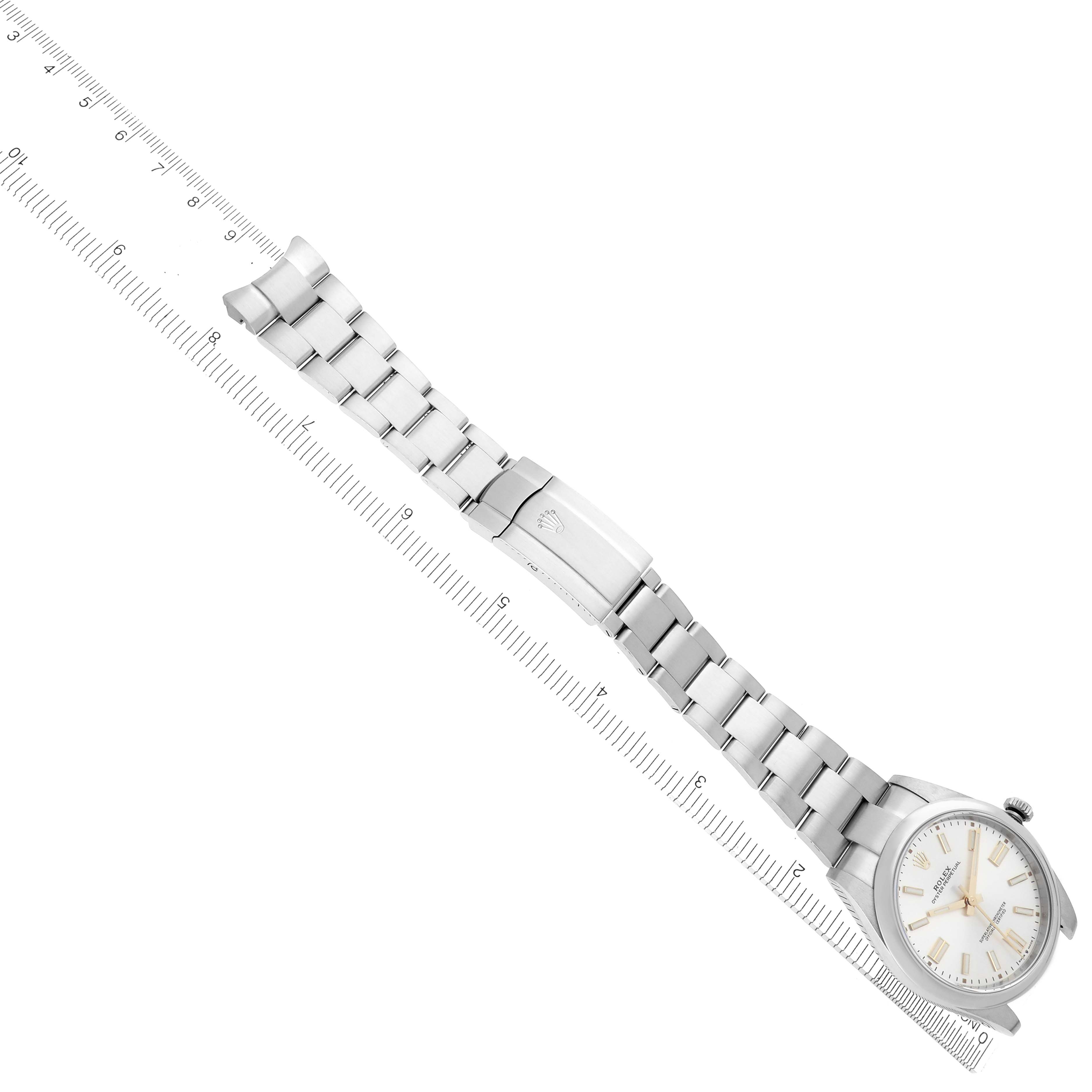 The Rolex Oyster Perpetual 124300 Men's Stainless Steel Silver Dial 124300 Men's Stainless Steel Silver Dial watch is shown at an angle, highlighting the bracelet, clasp, and part of the dial.