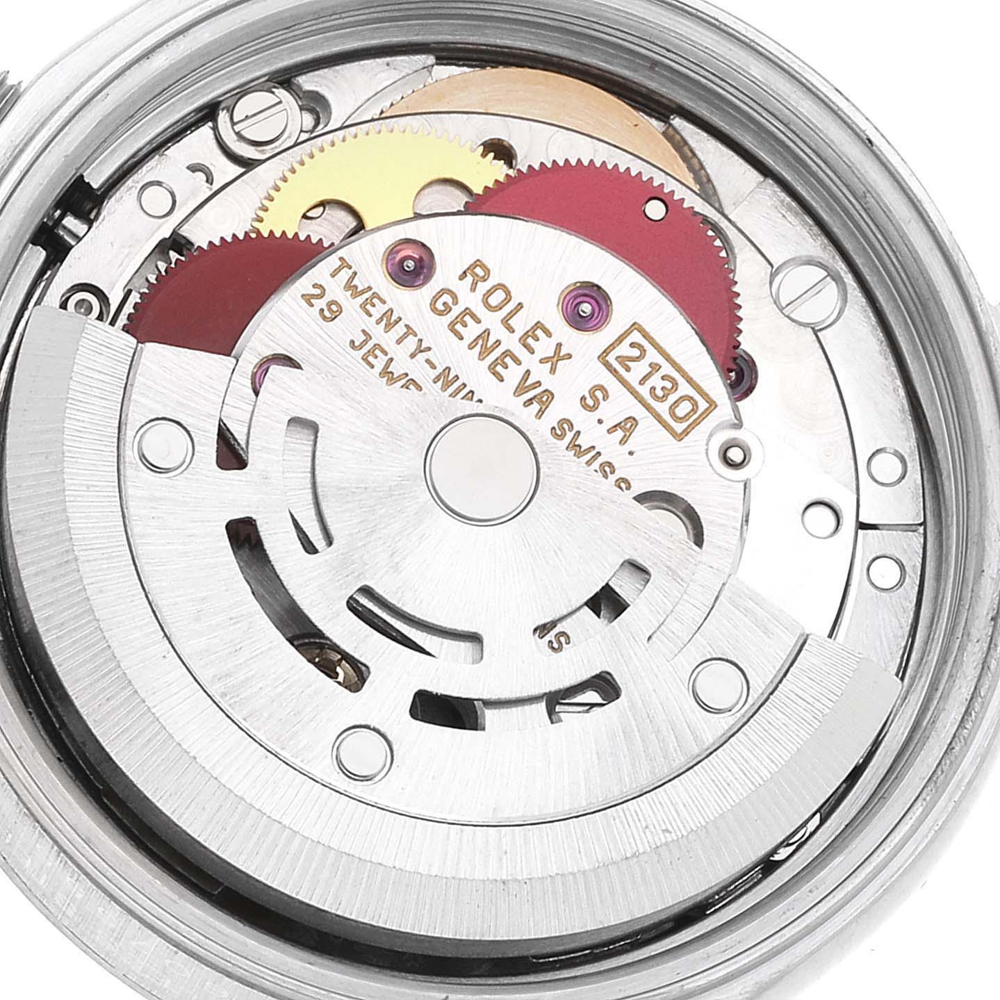 The image shows a close-up of the movement mechanism of a Rolex Oyster Perpetual 67180 Women's Stainless Steel Black Dial 67180 Women's Stainless Steel Black Dial watch, highlighting gears and the rotor.