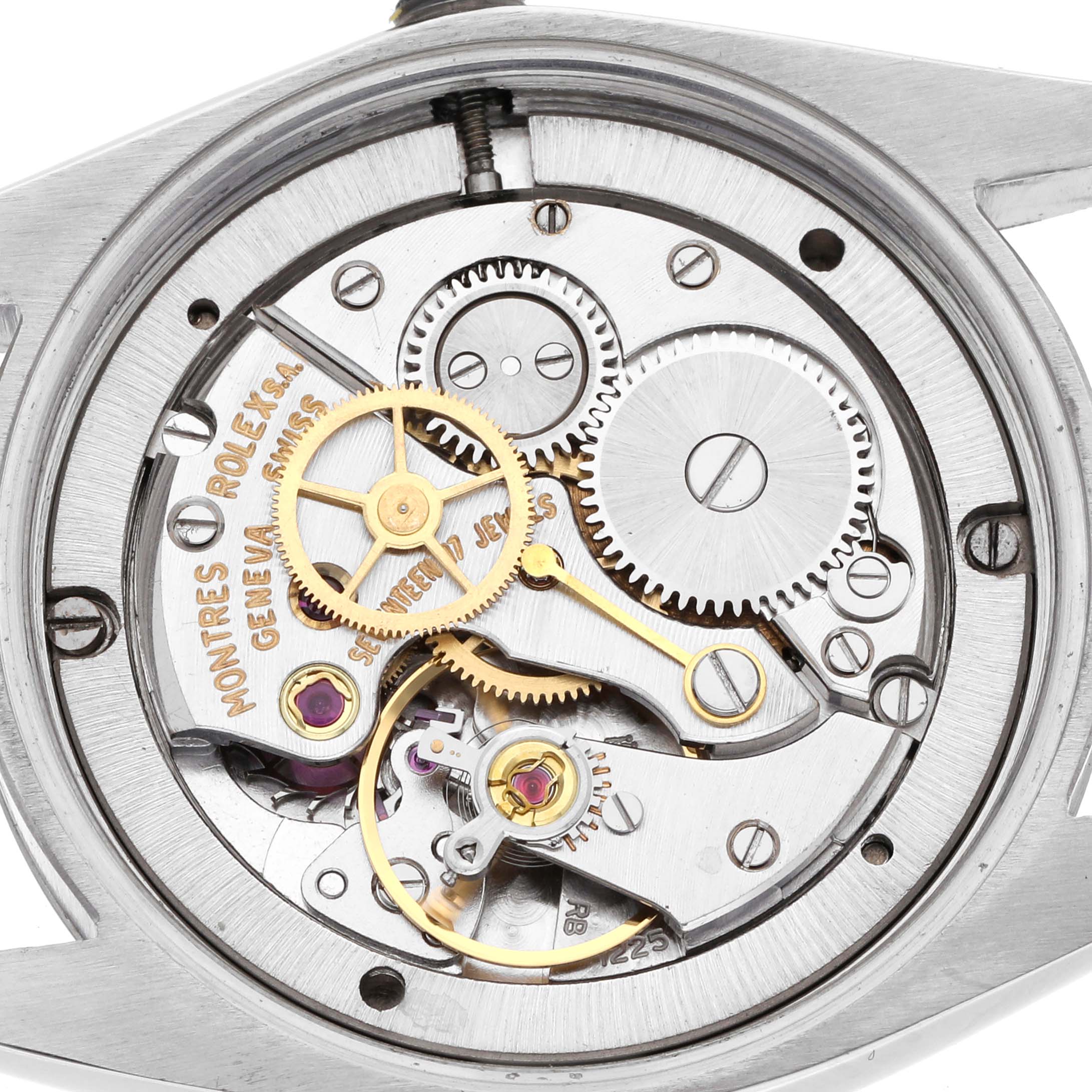 The image shows the movement of a Rolex Date 6694 Men's Stainless Steel Blue Dial 6694 Men's Stainless Steel Blue Dial model watch from a top-down angle, highlighting gears and mechanisms.