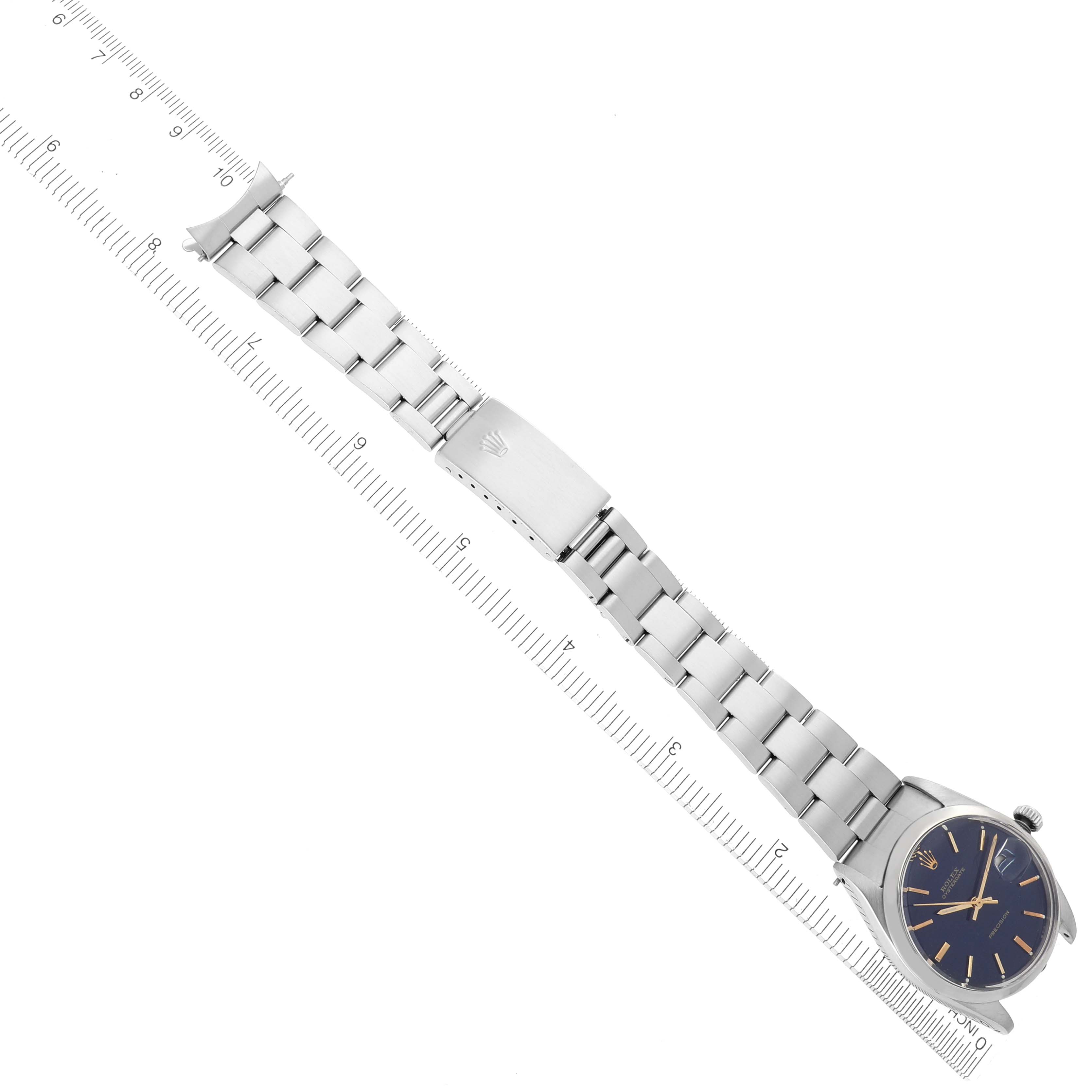 The Rolex Date 6694 Men's Stainless Steel Blue Dial 6694 Men's Stainless Steel Blue Dial watch is displayed at a slight angle, showcasing its bracelet, clasp, and face.