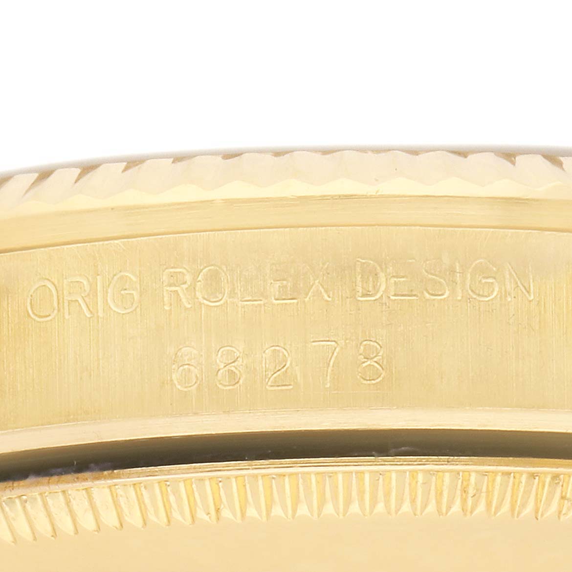 The image shows the engraved side of a Rolex Mid-Size model with the reference number and "ORIG ROLEX DESIGN" text.