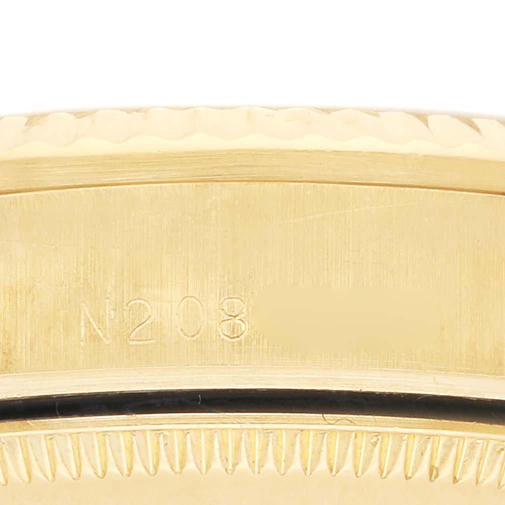 The image shows a close-up of the side of a Rolex Mid-Size watch, highlighting the case and serial number engraving.