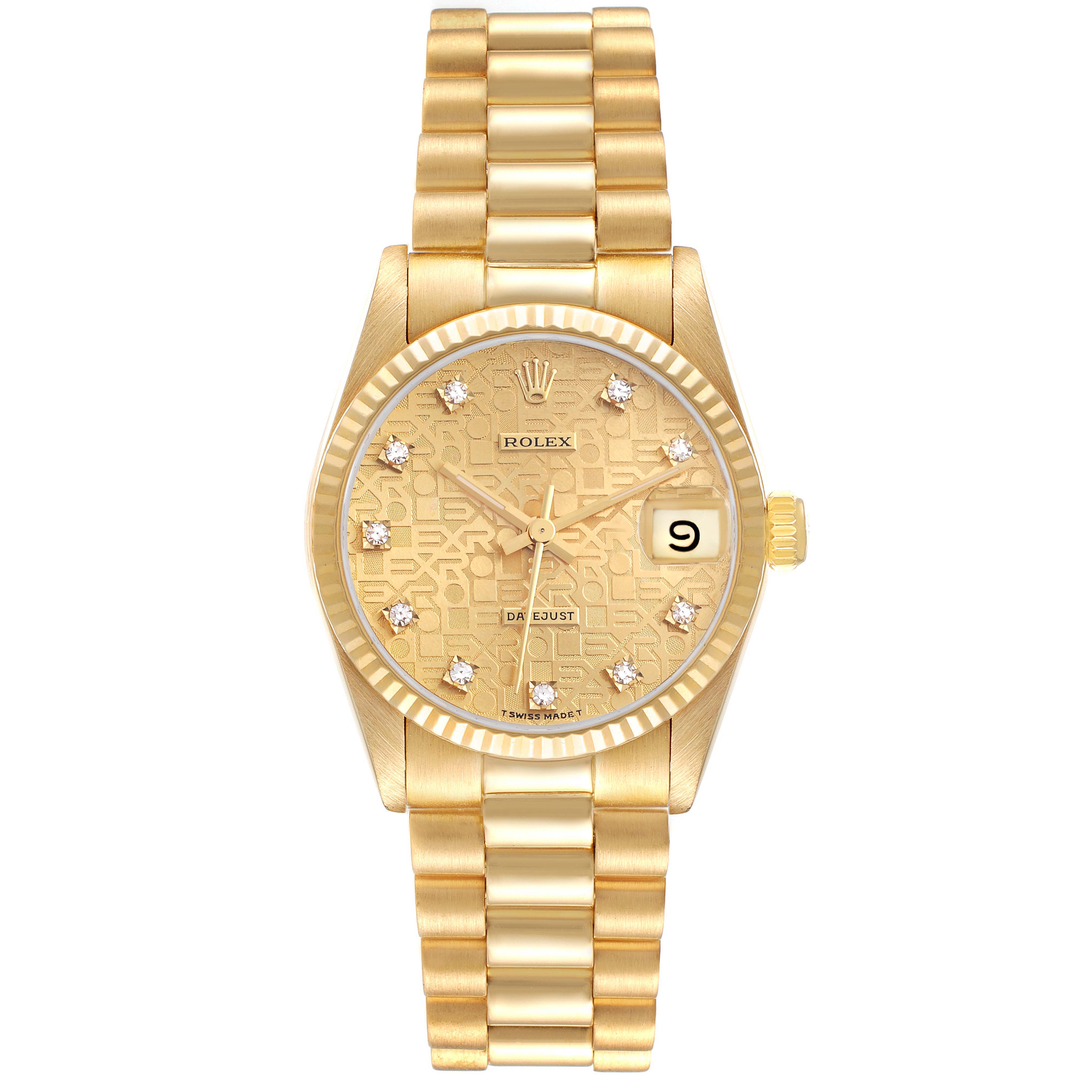 The Rolex Mid-Size watch is shown from a top-down angle, highlighting its gold bracelet, textured dial, and date window.