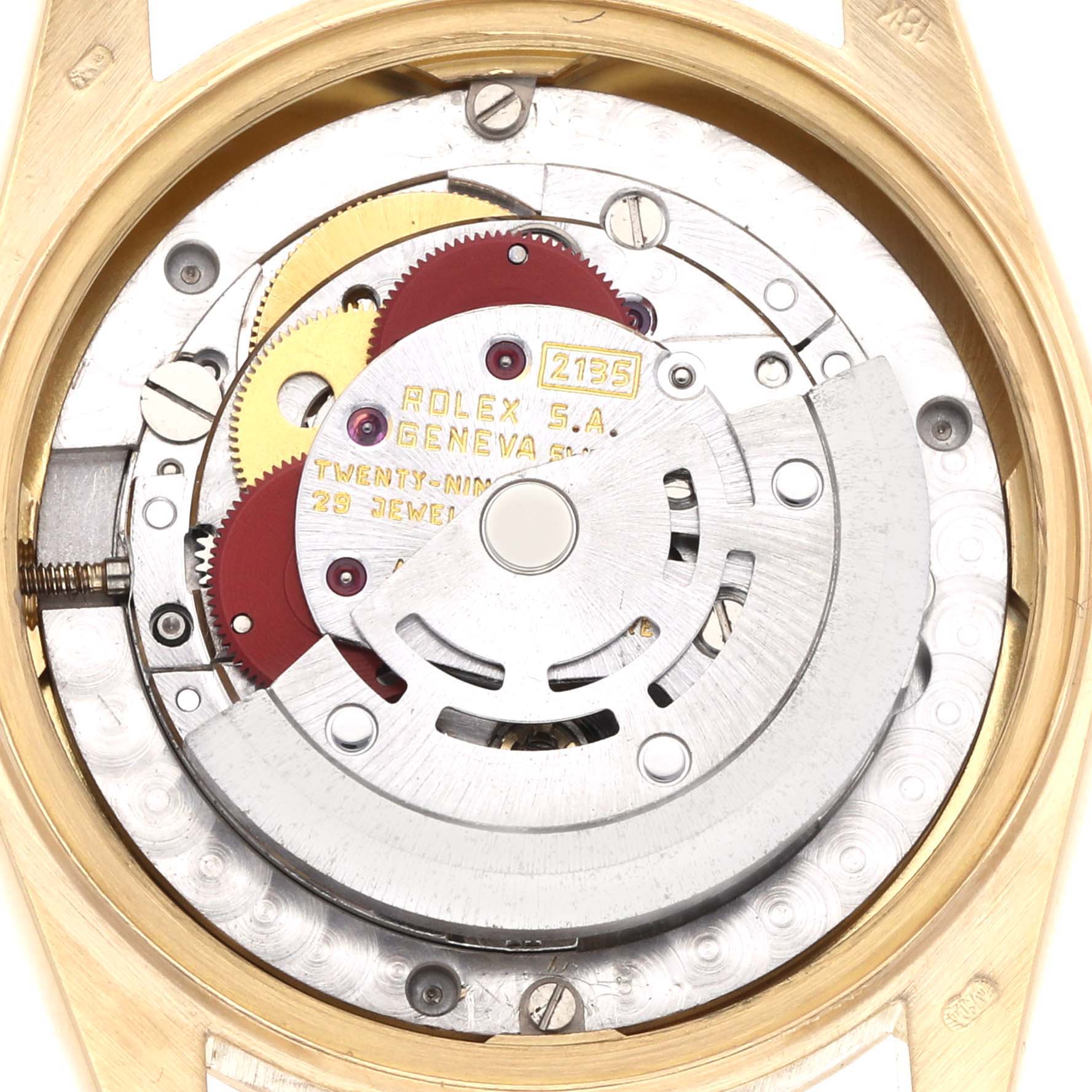 The image shows the movement and inner components of a Rolex Mid-Size watch from a back view.