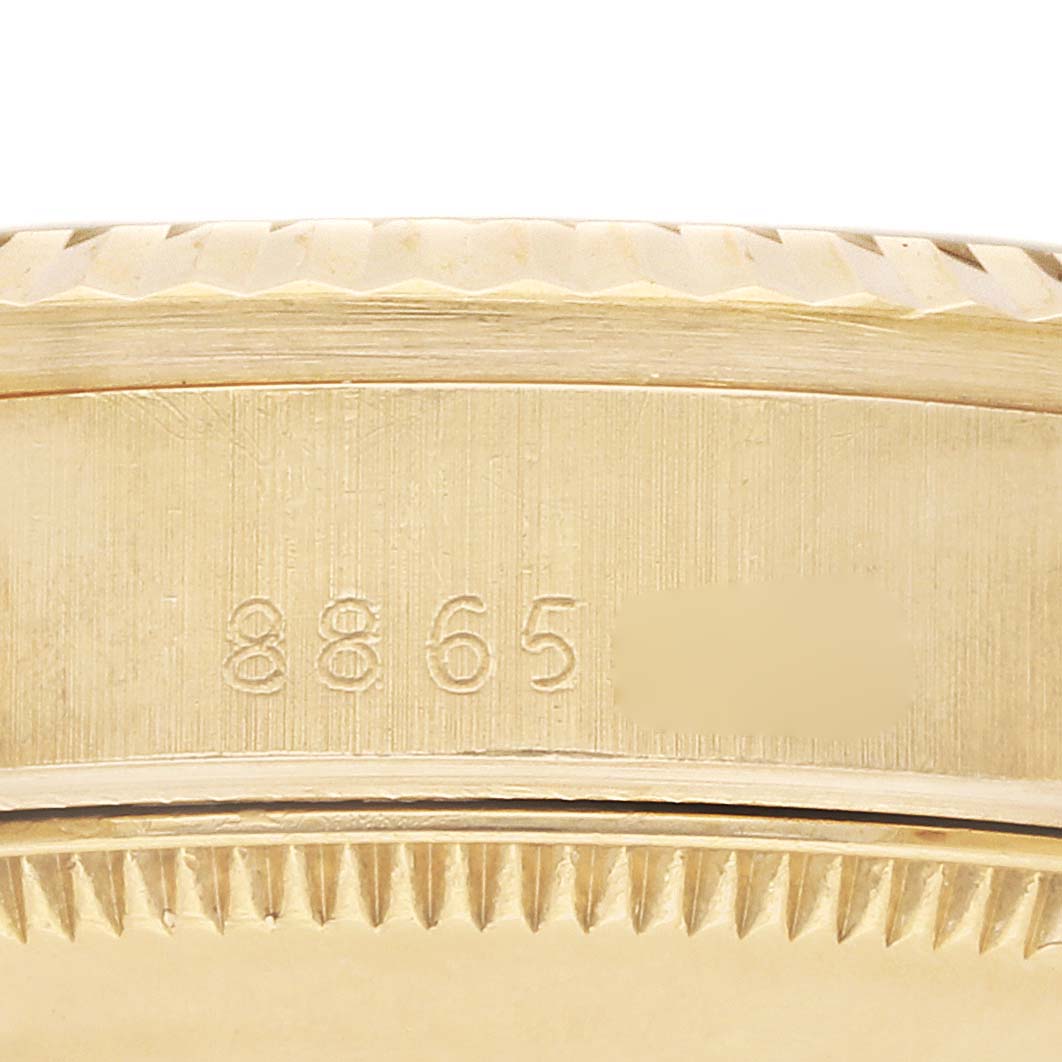 The image shows a close-up of the serial number on the side of a Rolex Mid-Size watch case.