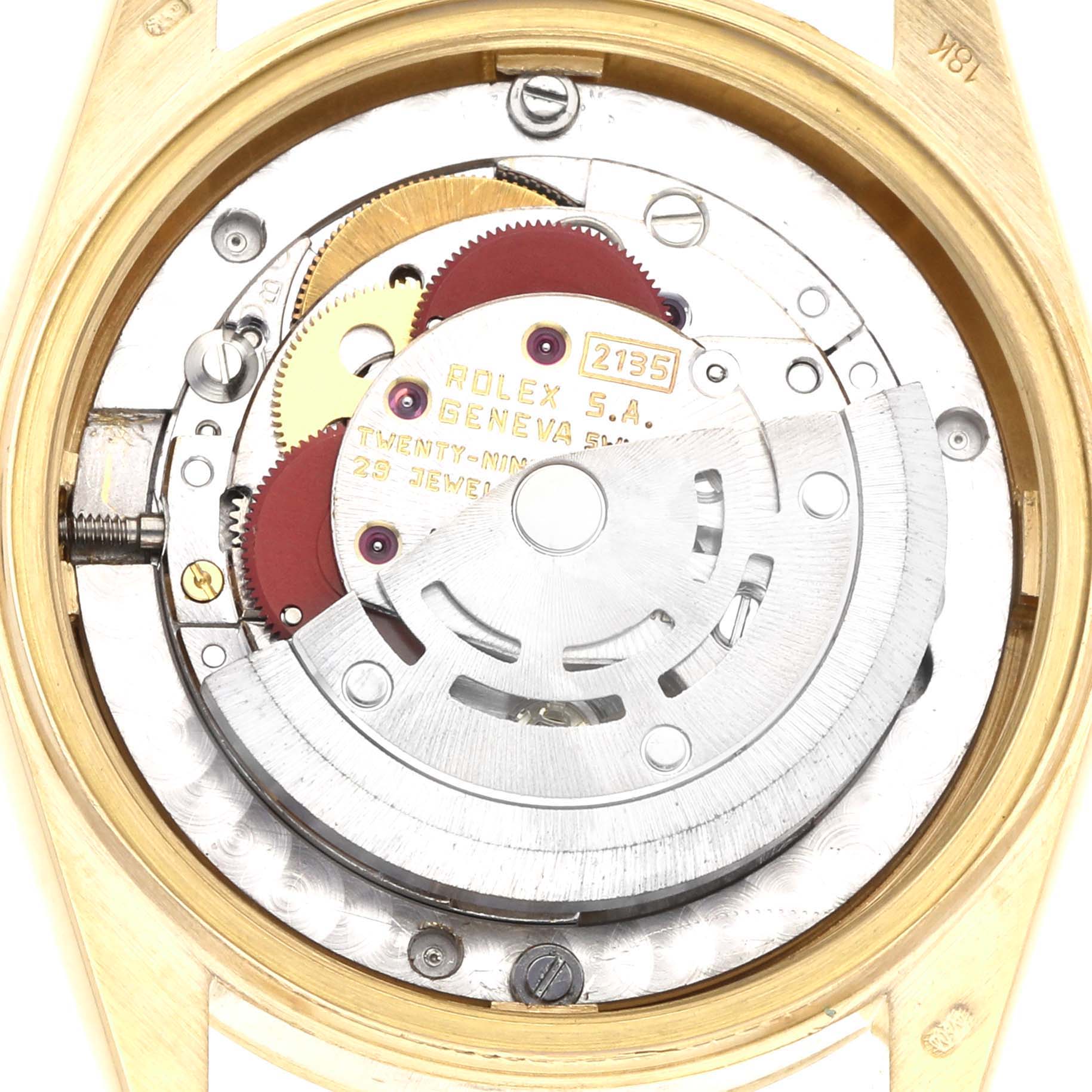 The image shows an overhead view of a Rolex Mid-Size watch's movement, highlighting the rotor and gears.