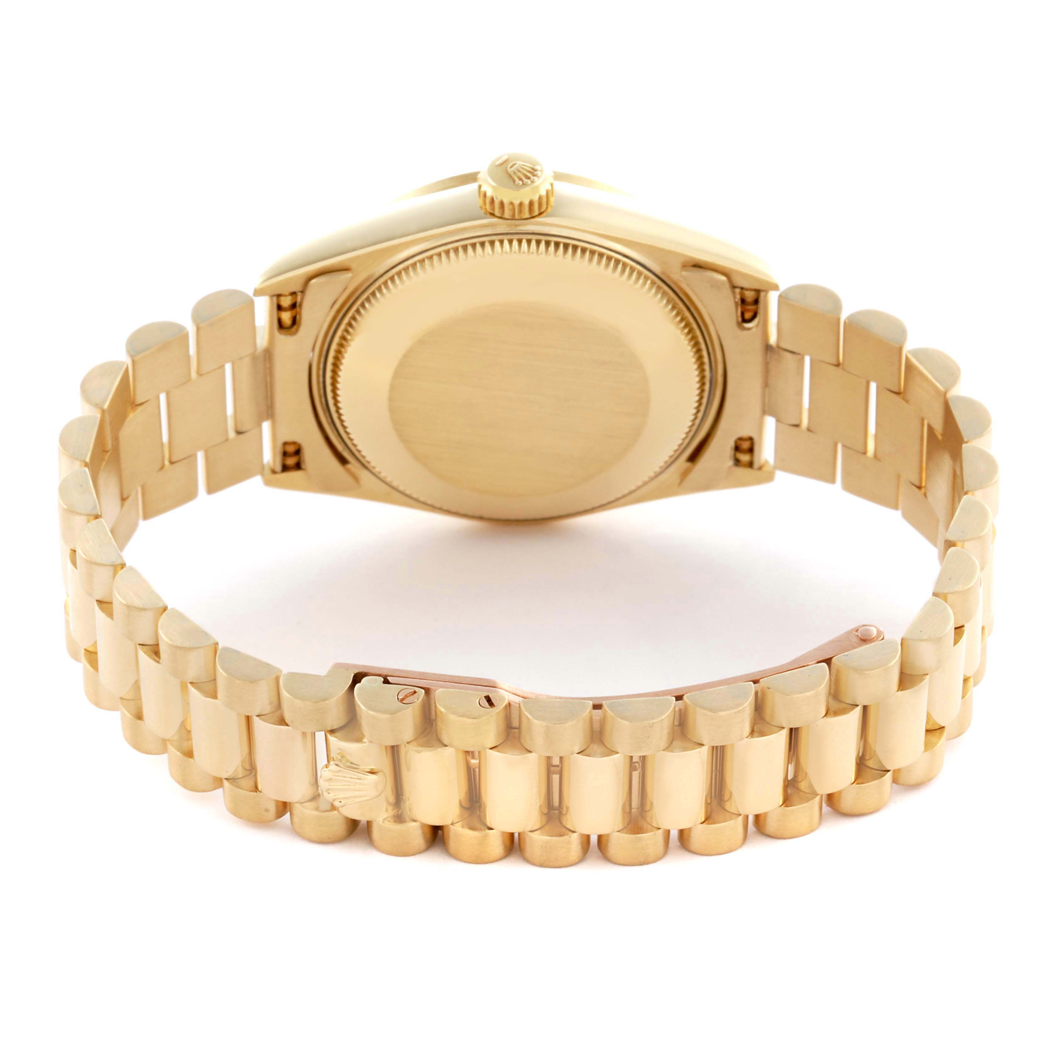 This image shows the back view of the Rolex Mid-Size watch, featuring its gold case back, crown, and bracelet.