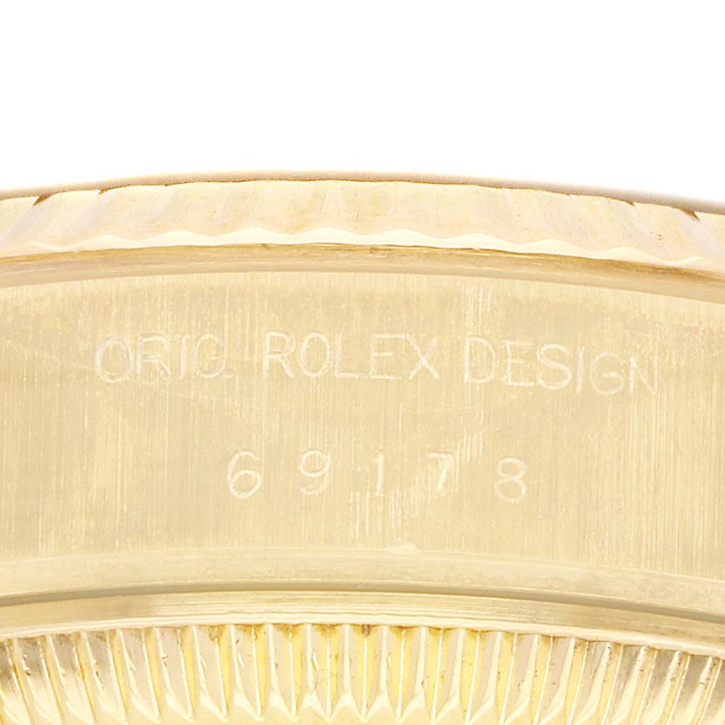 This close-up image shows the inscription on the side of the Rolex President 69178 Women's Yellow Gold Champagne Dial 69178 Women's Yellow Gold Champagne Dial model's case, featuring the model number "69178."