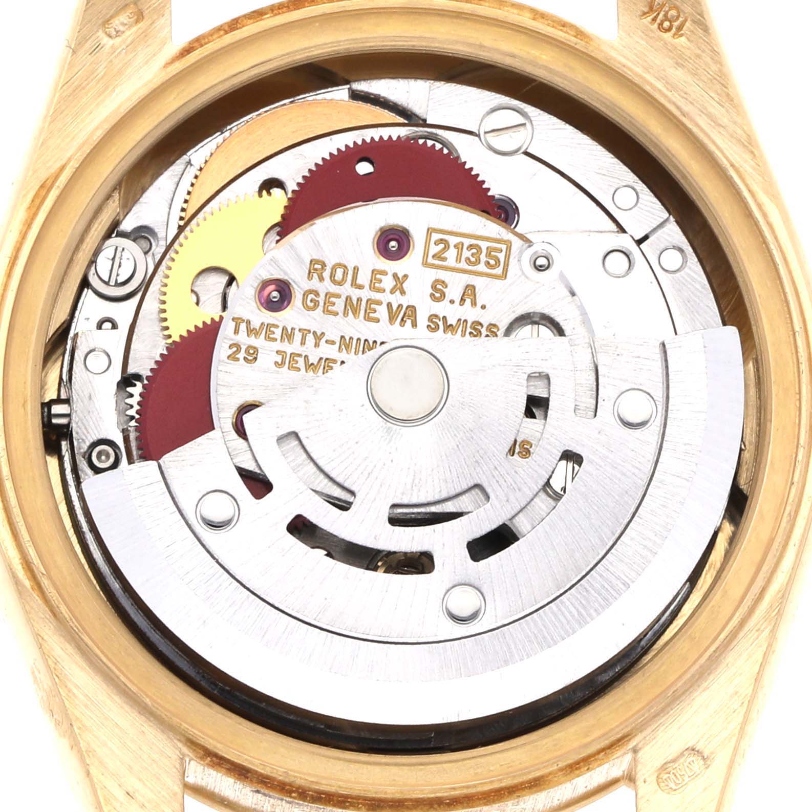The image shows the movement of a Rolex President 69178 Women's Yellow Gold Champagne Dial 69178 Women's Yellow Gold Champagne Dial model watch from a top-down angle, highlighting gears and rotor.