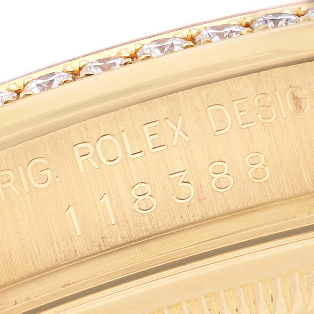 This close-up image shows the engraved model number and design details on the bezel of a Rolex President 118388 Men's Yellow Gold Green Dial 118388 Men's Yellow Gold Green Dial watch.
