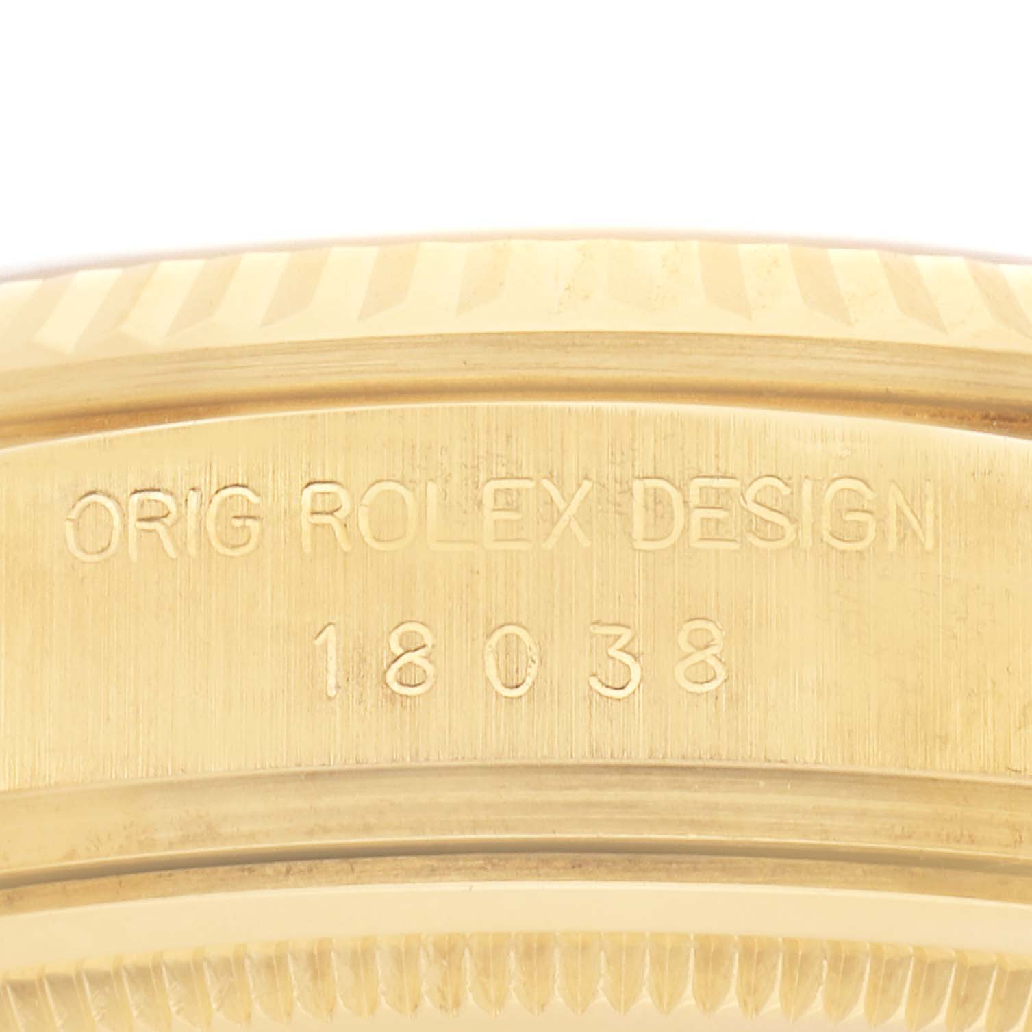 The image shows a close-up of the engraved side of a Rolex President 18038 Men
s Yellow Gold Champagne Dial 18038 Men
s Yellow Gold Champagne Dial model watch, highlighting the "Orig Rolex Design" and model number.