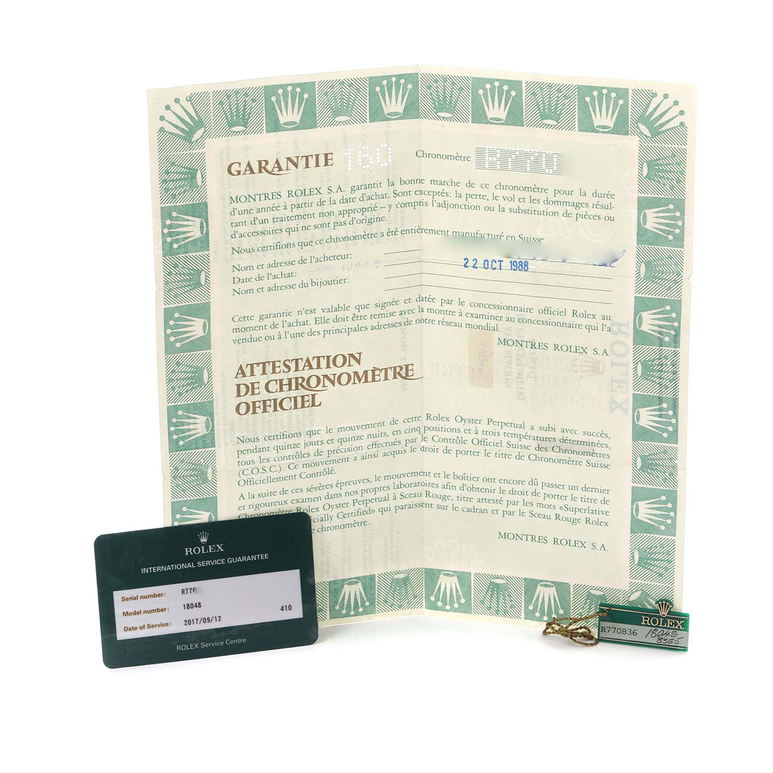 The image shows paperwork and accessories for a Rolex President 18048 Men's Yellow Gold Champagne Dial 18048 Men's Yellow Gold Champagne Dial model, including a certificate and tags.