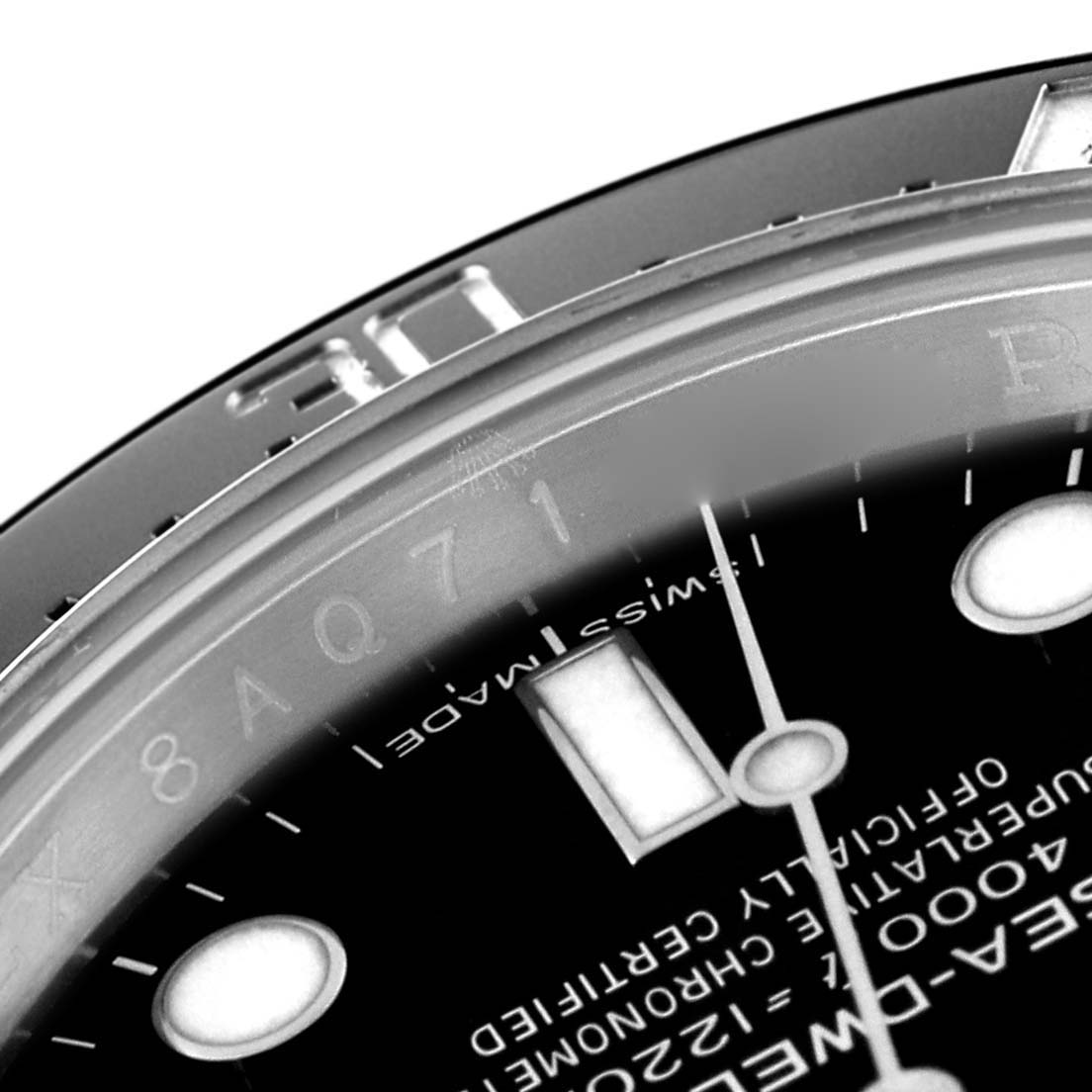 This is a close-up image of a Rolex Sea-Dweller 116600 Men's Stainless Steel Black Dial 116600 Men's Stainless Steel Black Dial watch showing part of the dial, bezel, and the Swiss Made text.