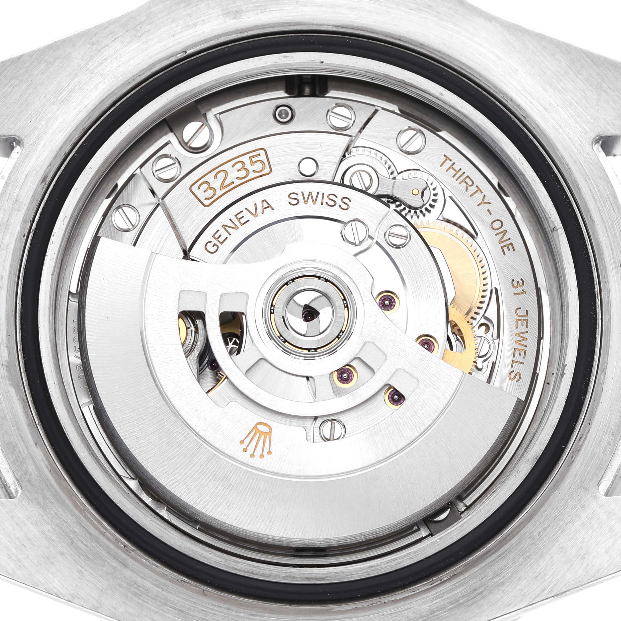 The image shows the back view of the Rolex Sea-Dweller 126600 Men's Stainless Steel Black Dial model, highlighting its movement and intricate inner mechanics.