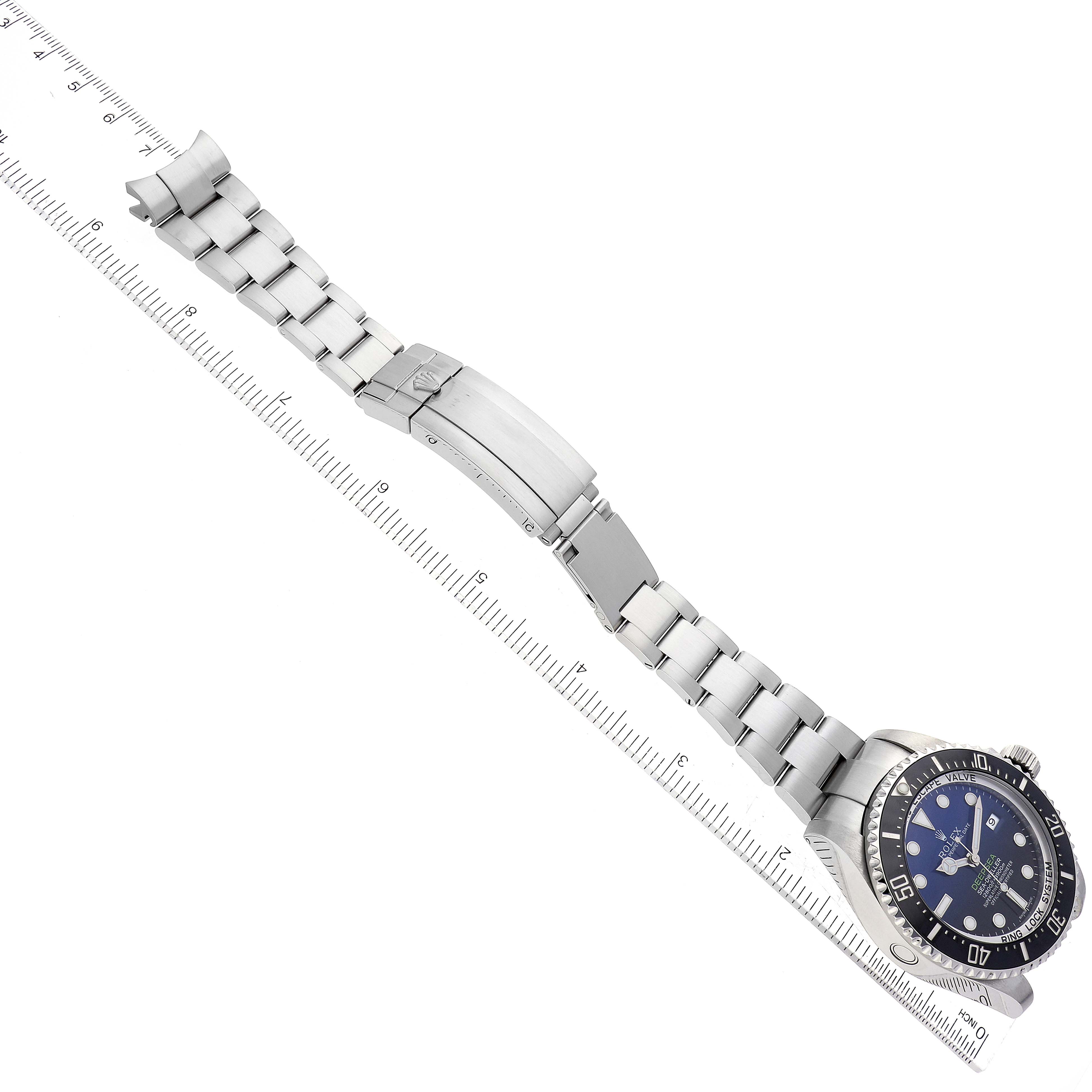 The Rolex Sea-Dweller 116660 Men's Stainless Steel Blue Dial 116660 Men's Stainless Steel Blue Dial watch is shown from a top view, displaying the full face, bezel, and extended bracelet with clasp.