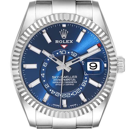 The Rolex Sky-Dweller watch is shown from a front angle, displaying the blue dial, bezel, hands, markers, date, and crown.