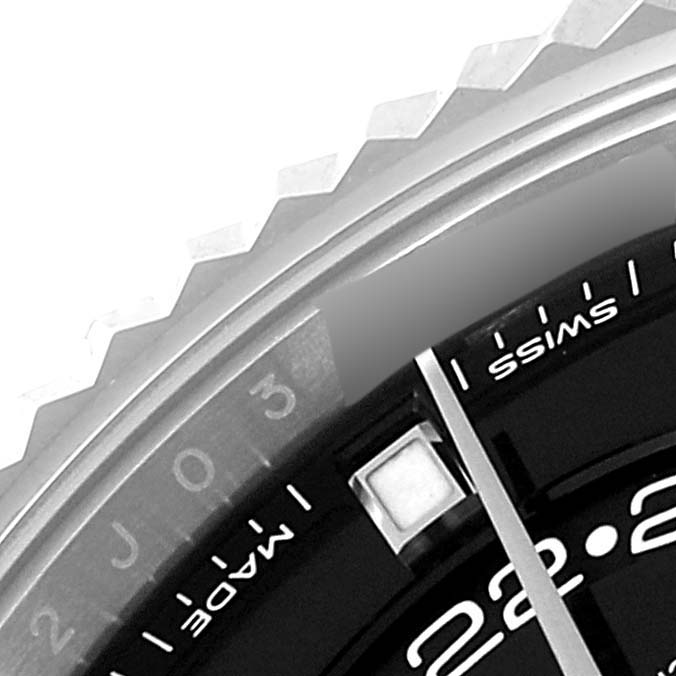 This close-up image shows a partial view of the dial, bezel, and minute hand of the Rolex Sky-Dweller 326934 Men's Stainless Steel Black Dial 326934 Men's Stainless Steel Black Dial watch.