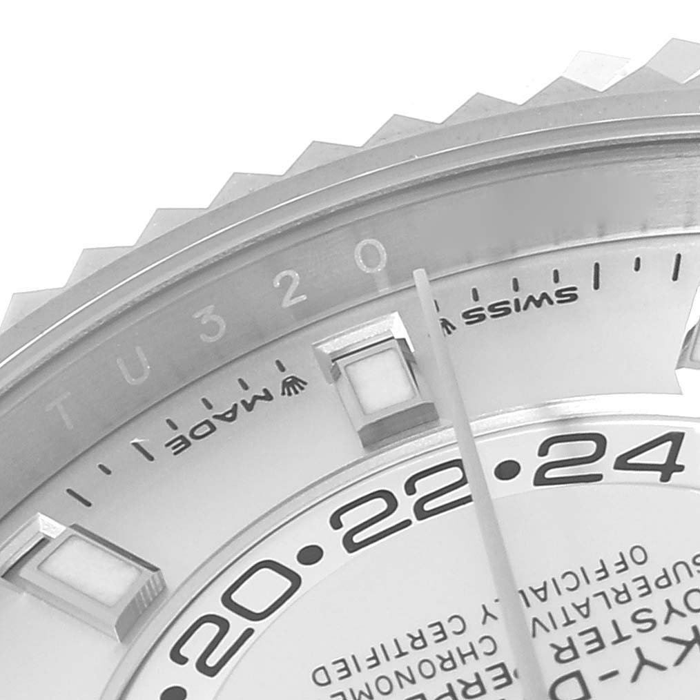 This close-up shows the dial, part of the bezel, and markers on the Sky-Dweller model by Rolex.