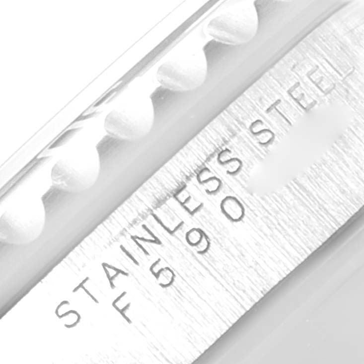 The image shows a close-up of the stainless steel bezel and part of the bracelet of a Rolex Submariner 14060 Men
s Stainless Steel Black Dial 14060 Men
s Stainless Steel Black Dial watch.