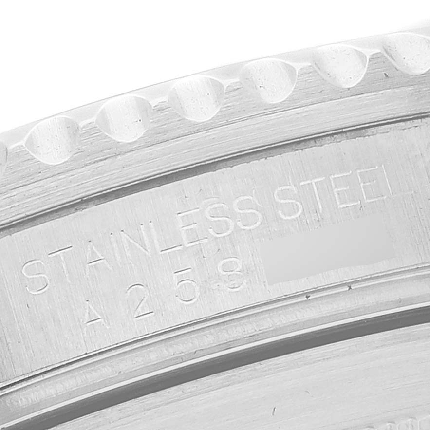 The image shows a close-up view of the stainless steel engraved side of a Rolex Submariner 16610 Men
s Stainless Steel Black Dial 16610 Men
s Stainless Steel Black Dial watch
s case.