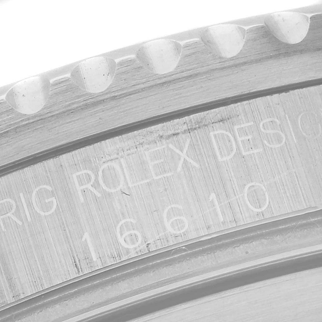The image shows a close-up of the bezel and engraved model number on the Rolex Submariner 16610 Men's Stainless Steel Black Dial 16610 Men's Stainless Steel Black Dial watch.