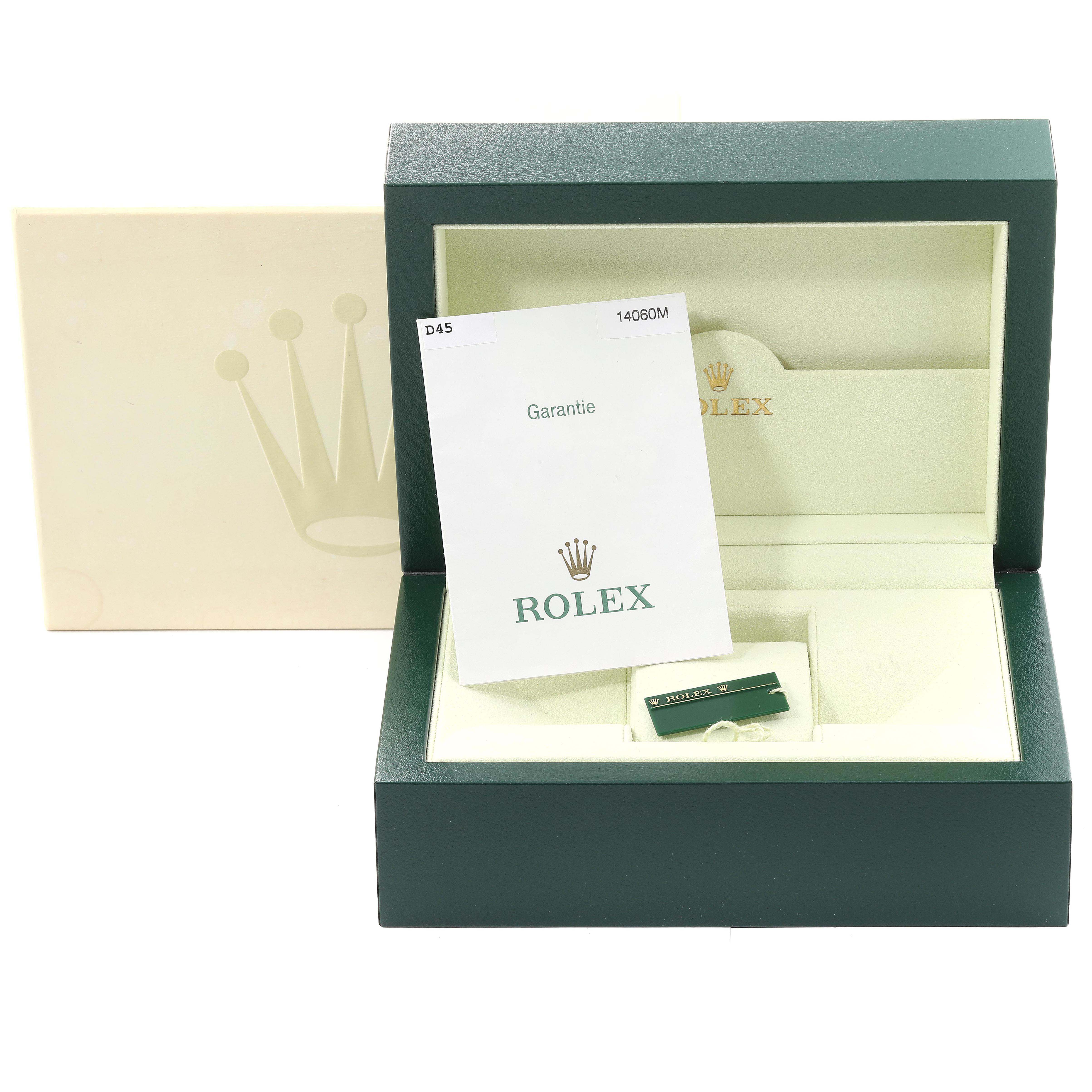 The image shows the open box of a Rolex Submariner 14060M Men's Stainless Steel Black Dial 14060M Men's Stainless Steel Black Dial watch with warranty card and accessories.