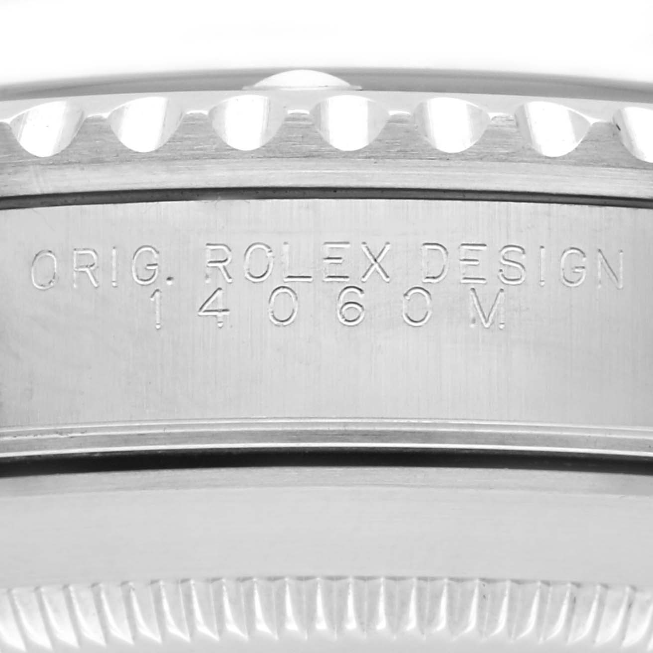 The image shows the side of a Rolex Submariner 14060M Men's Stainless Steel Black Dial watch case, highlighting the engraved design reference number "14060M."
