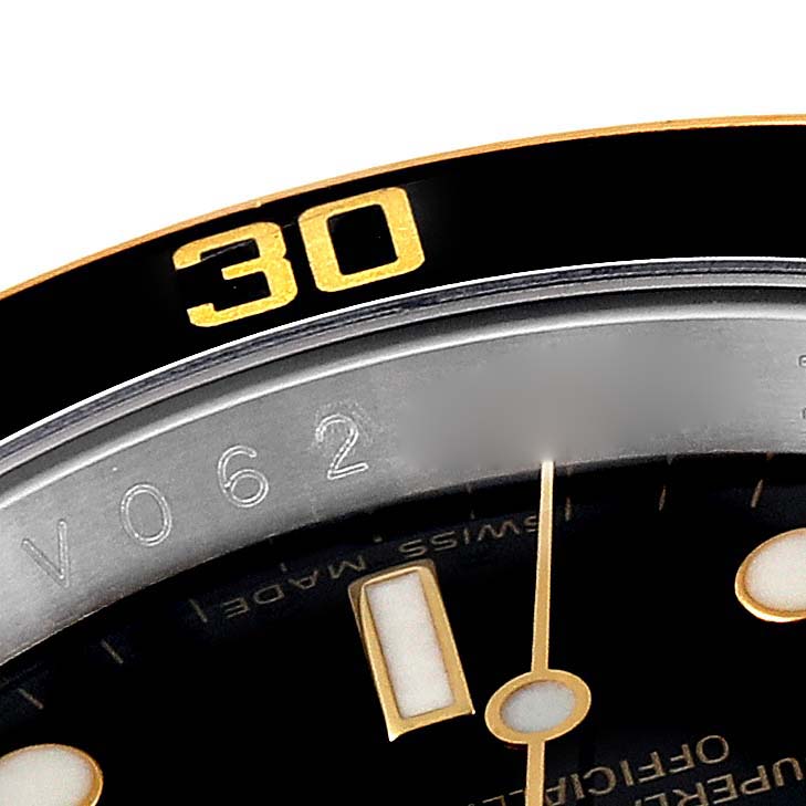 The image shows a close-up of the bezel and dial area of a Rolex Submariner 16613 Men's Steel and Gold (two tone) Black Dial, highlighting the "30" marker.