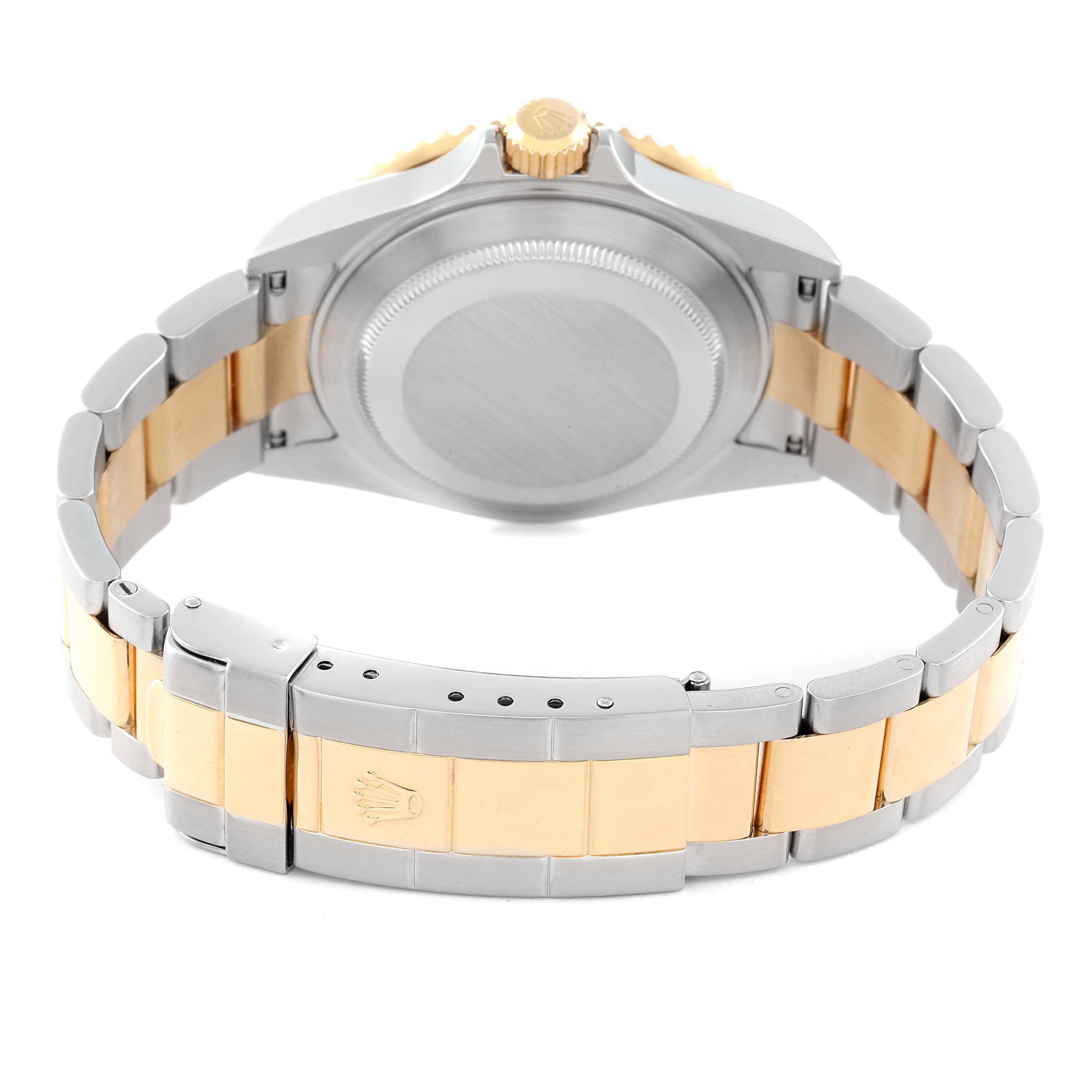 The image shows the back of a Rolex Submariner 16613 Men's Steel and Gold (two tone) Black Dial, highlighting the case back and clasp with its two-tone bracelet.