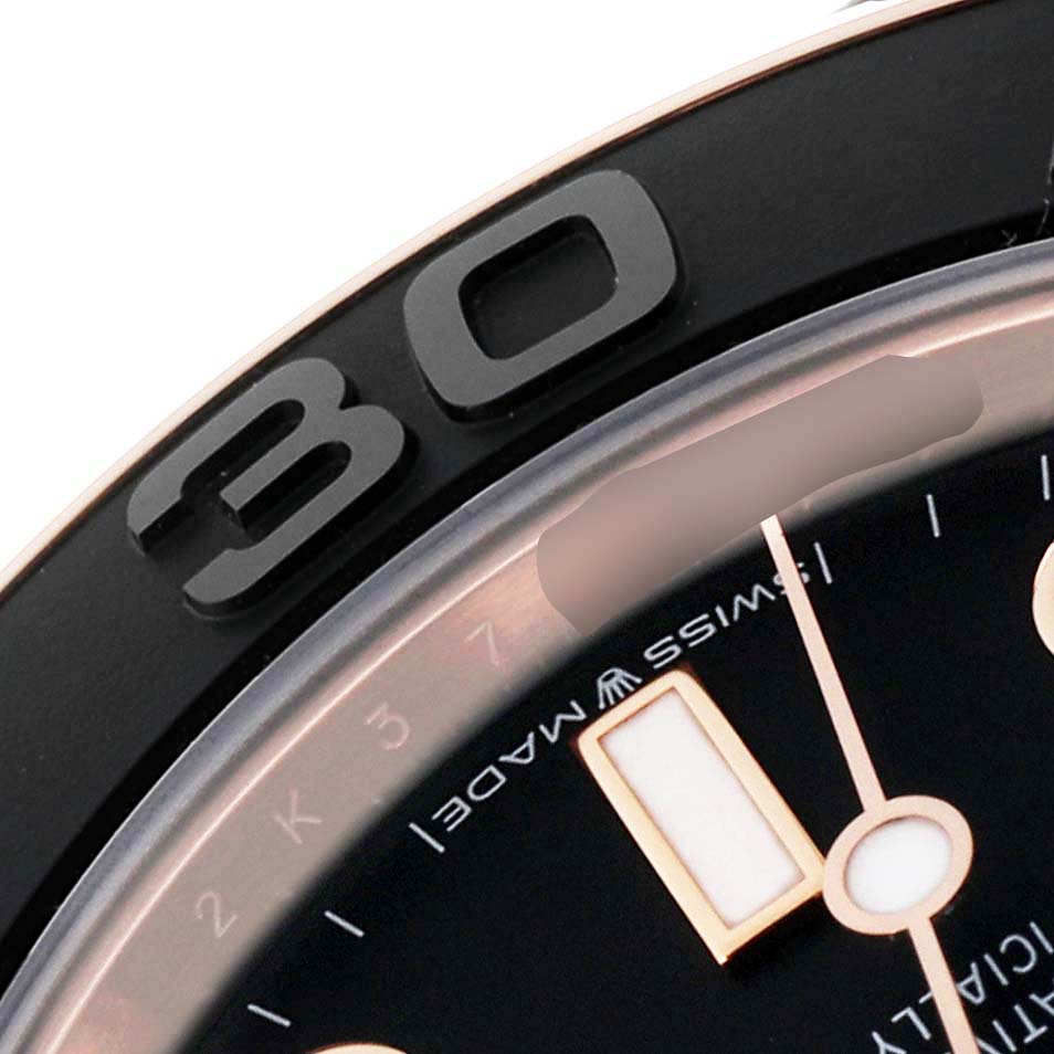 This close-up image shows the bezel and part of the dial on a Rolex Yacht-Master 268655 Men's Rose Gold Black Dial 268655 Men's Rose Gold Black Dial watch.